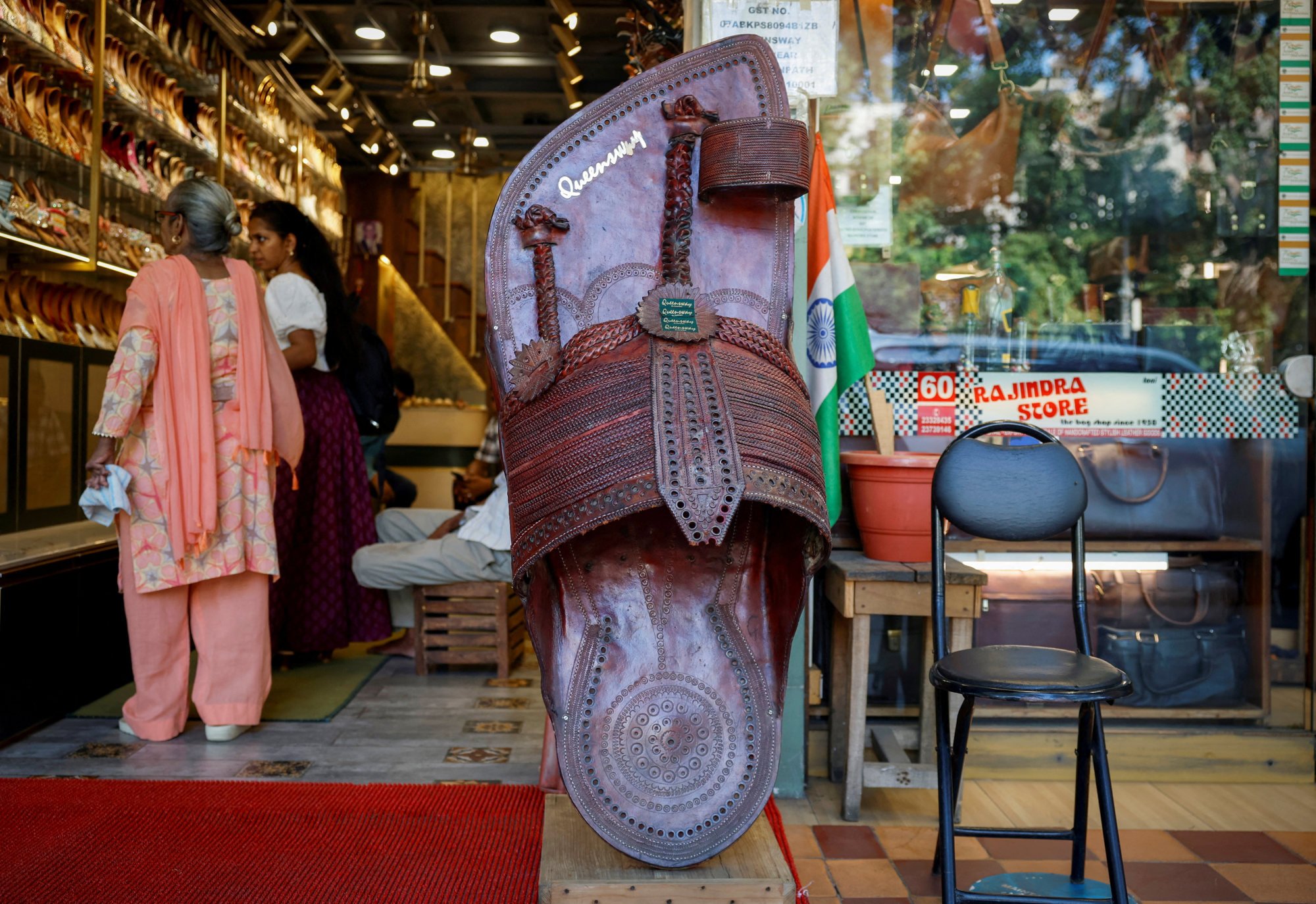 Customers shop for Kolhapuri chappals at a shop in New Delhi, India, last month. Photo: Reuters Customers shop for Kolhapuri chappals at a shop in New Delhi, India, last month. Photo: Reuters