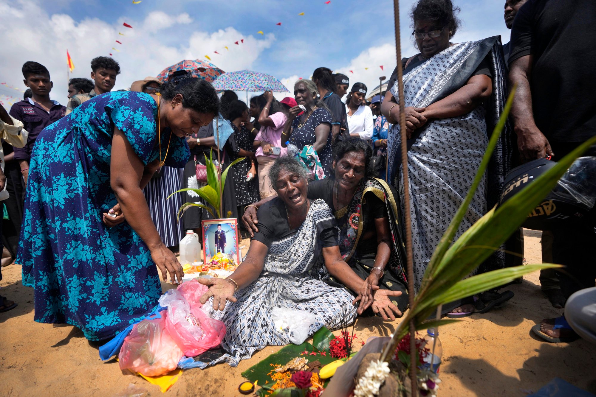 A Tamil war survivor is consoled during a May 17, 2024, remembrance ceremony in Mullivaikkal, Sri Lanka – the site where thousands of civilians were trapped in the final stages of the country’s civil war. Photo: AP A Tamil war survivor is consoled during a May 17, 2024, remembrance ceremony in Mullivaikkal, Sri Lanka – the site where thousands of civilians were trapped in the final stages of the country’s civil war. Photo: AP