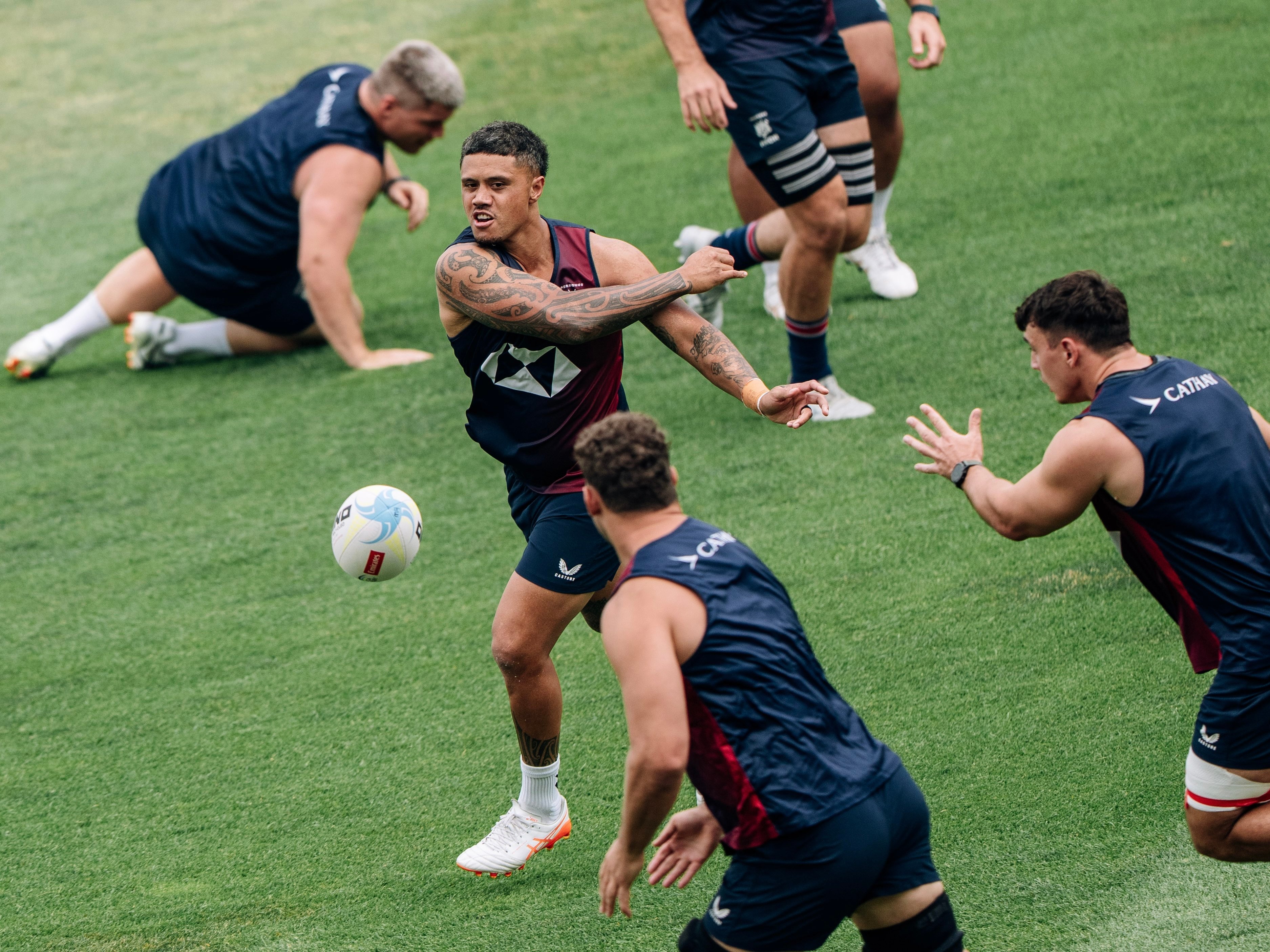 Hong Kong flyhalf Nathan De Thierry (top) fires a pass to captain and No 8 Josh Hrstich during the Captain’s Run on Friday in Incheon, South Korea. Photo: Patrick Leung
