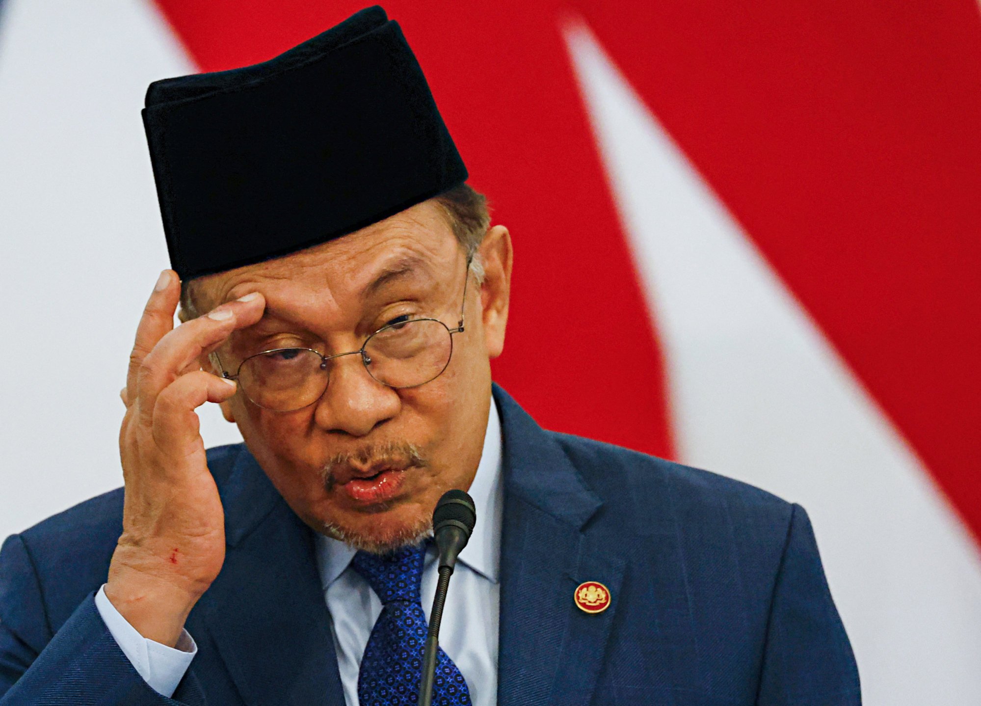 Malaysian Prime Minister Anwar Ibrahim, who also serves as finance minister, has cut a range of subsidies and other government spending while in office. Photo: Retuers Malaysian Prime Minister Anwar Ibrahim, who also serves as finance minister, has cut a range of subsidies and other government spending while in office. Photo: Retuers