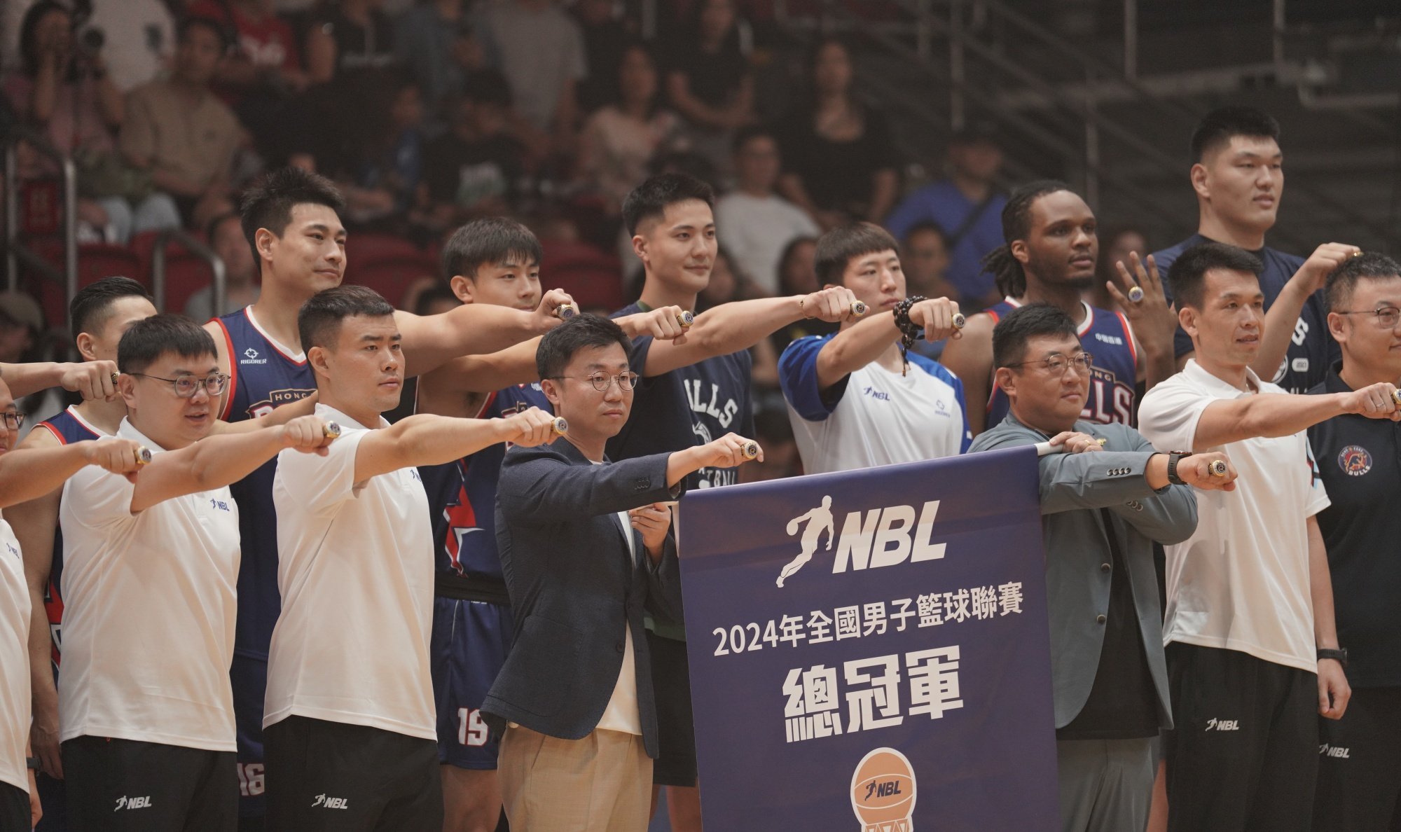 Hong Kong Bulls staff and players display their championship rings before the National Basketball League opener at Southorn Stadium last Saturday. Photo: Handout