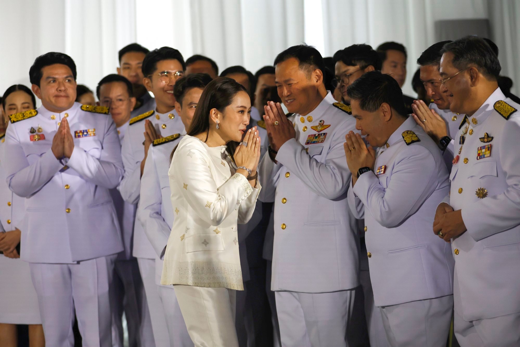Paetongtarn (centre) greets Bhumjaithai party’s leader Anutin Charnvirakul (third from right) after being appointed as Thailand’s prime minister in August 2024. Photo: EPA-EFE Paetongtarn (centre) greets Bhumjaithai party’s leader Anutin Charnvirakul (third from right) after being appointed as Thailand’s prime minister in August 2024. Photo: EPA-EFE