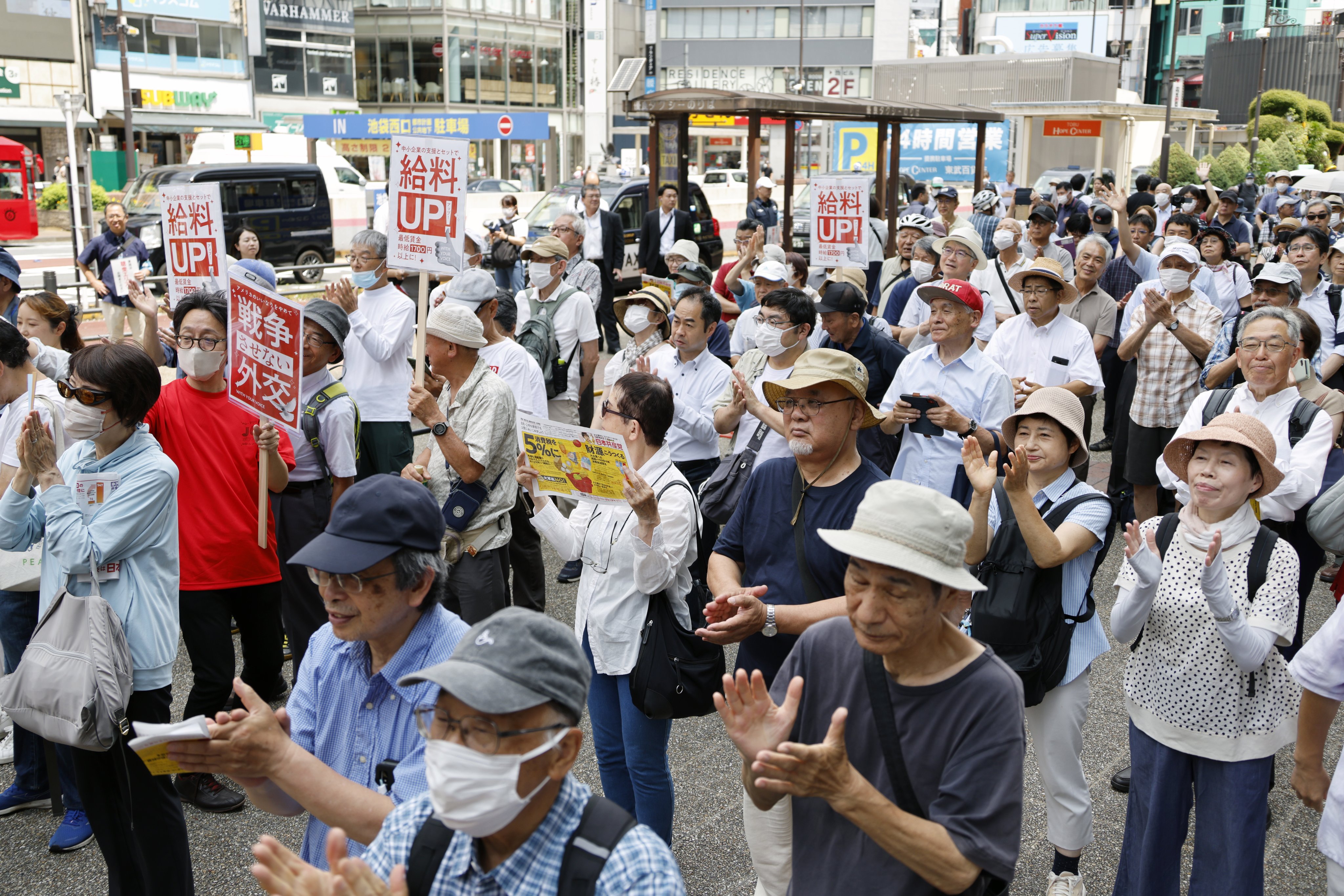 People attend an election campaign rally in Tokyo on July 3. Photo: EPA