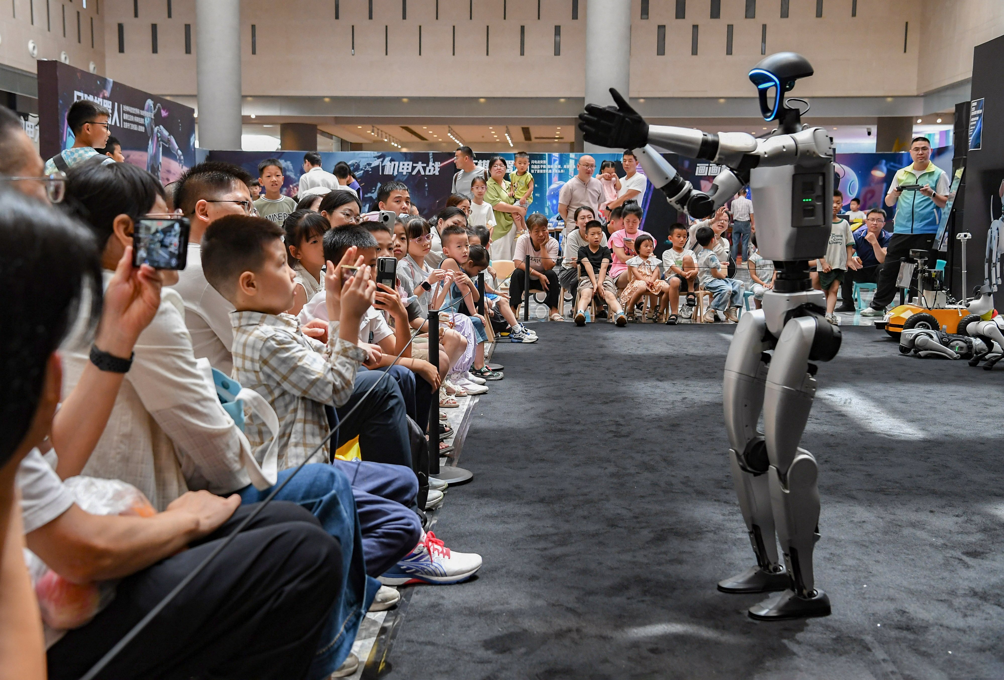 A humanoid robot interacts with crowds at an AI exhibition in Jinhua, central Zhejiang province in eastern China. Photo: Xinhua