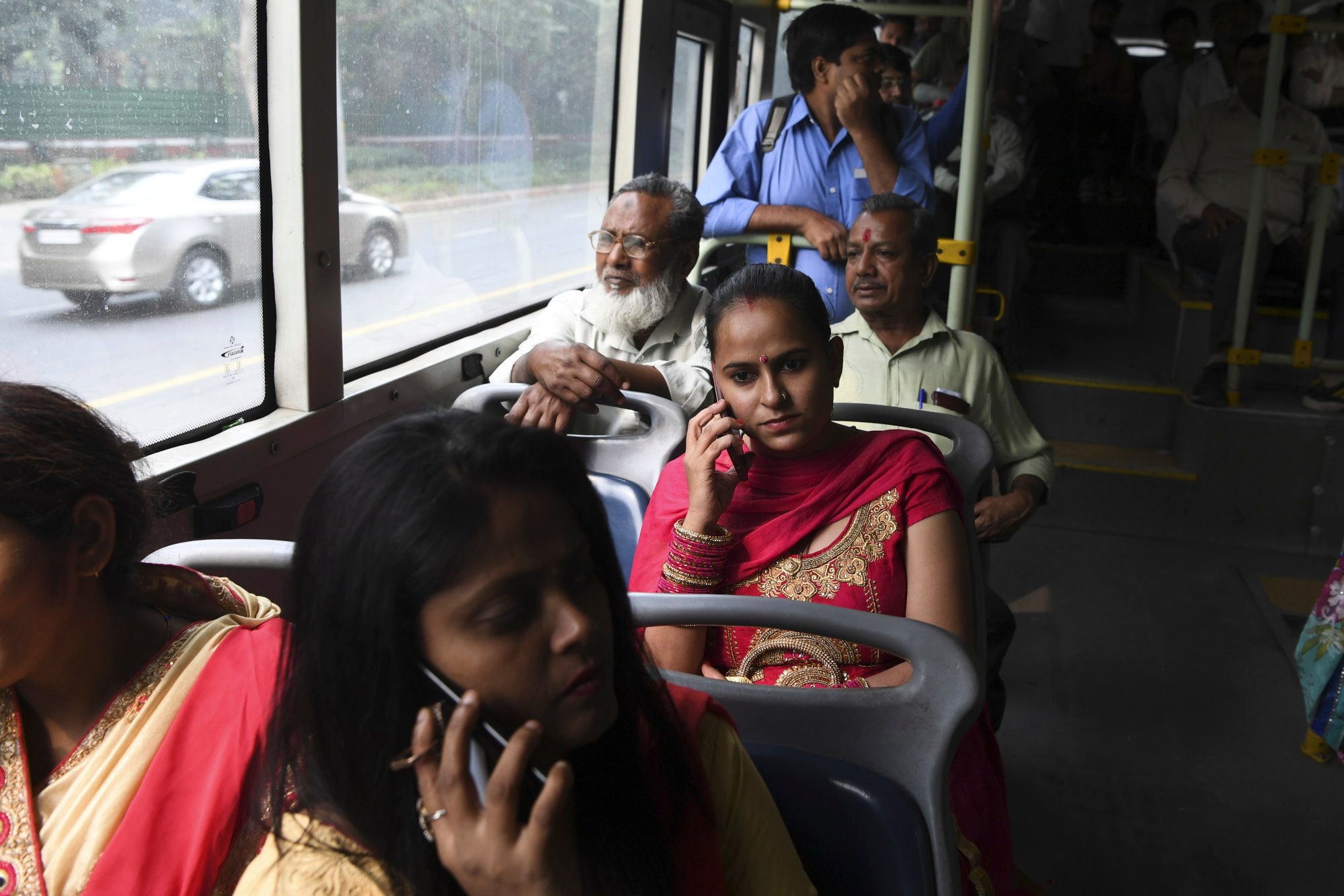 Commuters ride on a bus in New Delhi. Observers say the public transport system is not well integrated between different modes of transport. Photo: AFP Commuters ride on a bus in New Delhi. Observers say the public transport system is not well integrated between different modes of transport. Photo: AFP