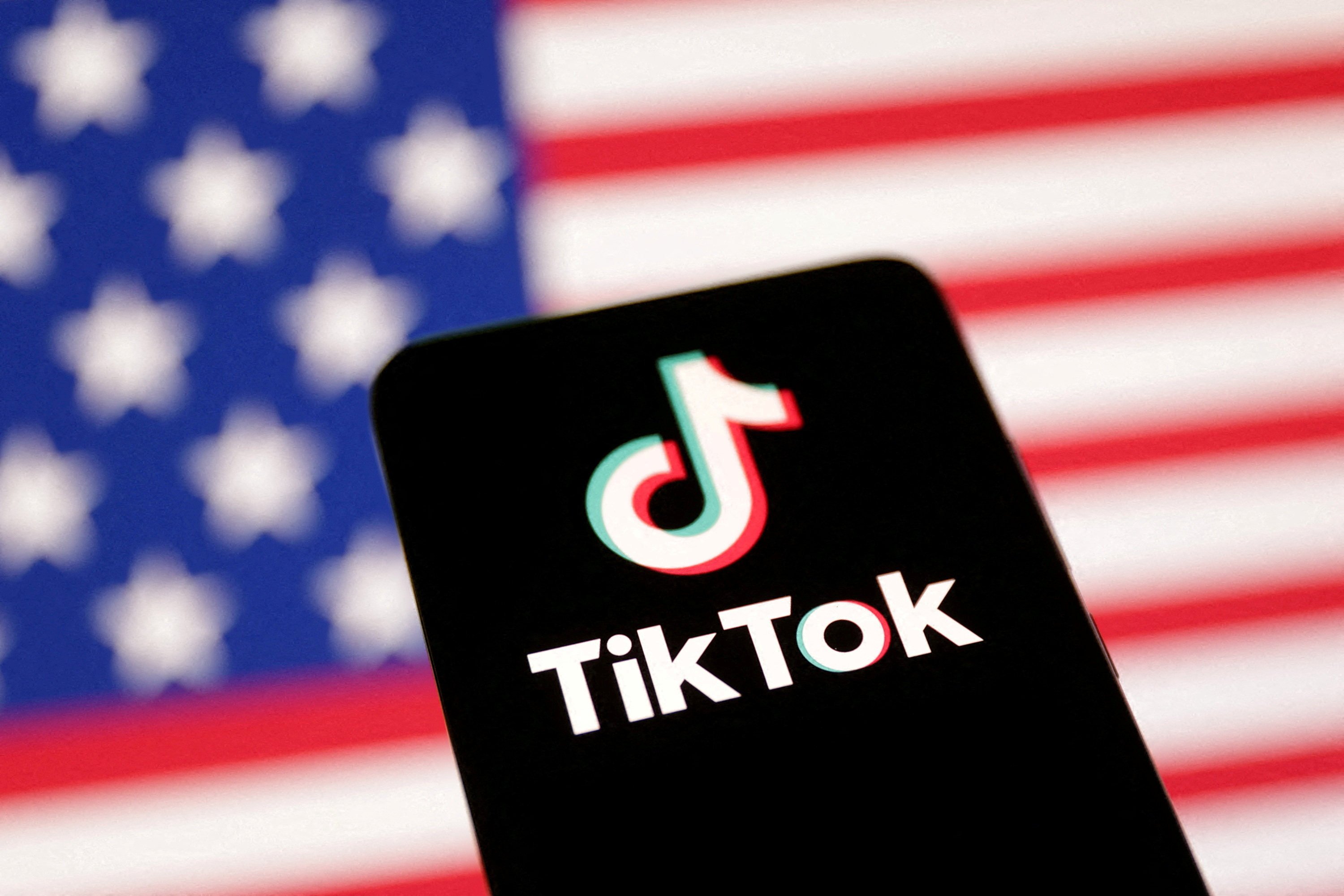 The US flag and TikTok logo. Photo: Dado Ruvic / Illustration / Reuters