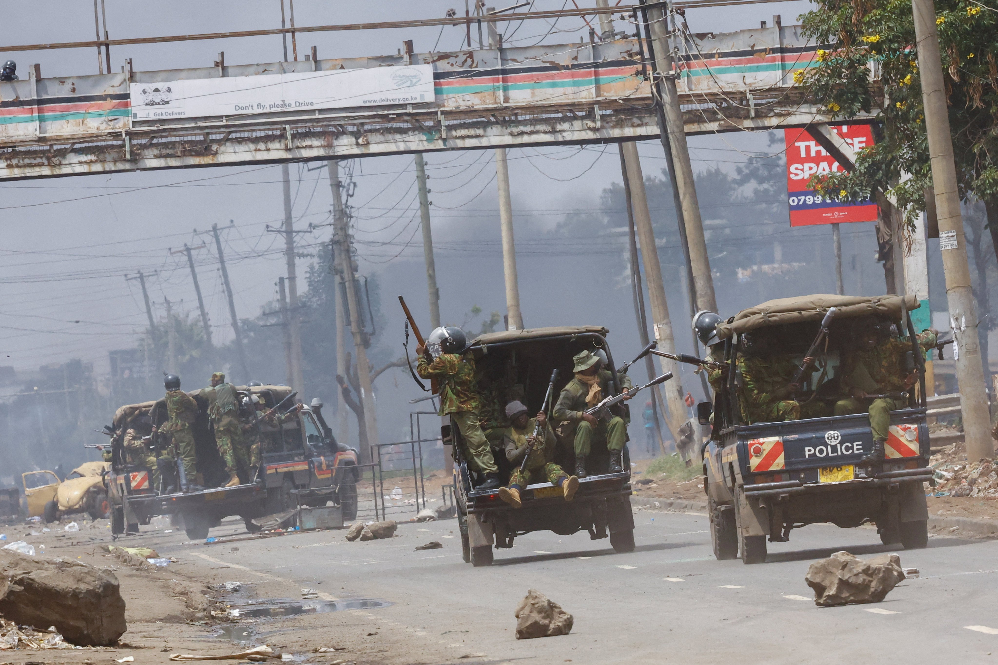 Riot police ride in their vehicles, shooting tear gas during clashes with demonstrators during anti-government protest in Nairobi, Kenya on Monday. Photo: Reuters
