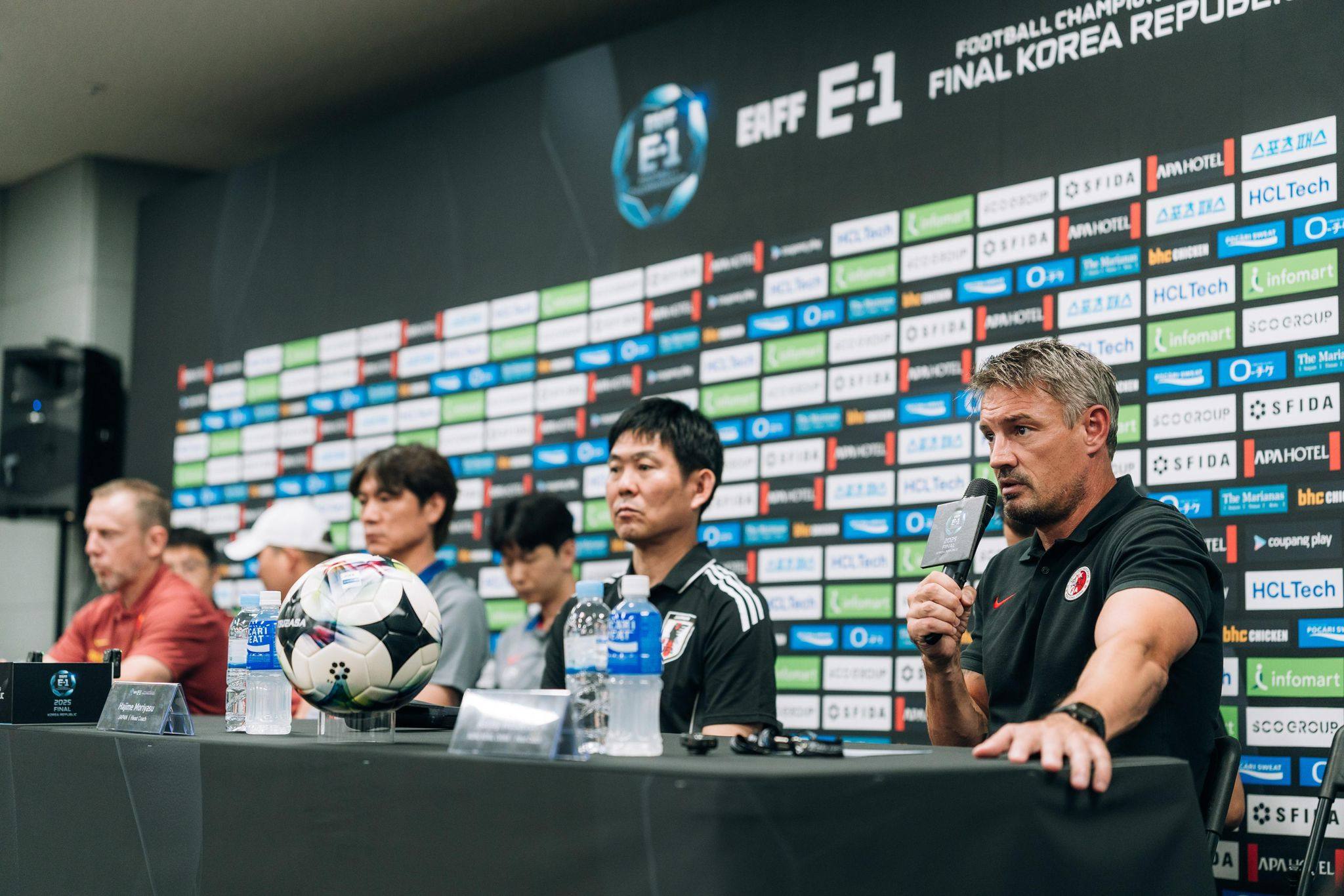 Hong Kong coach Ashley Westwood (right) speaks at a pre-tournament press conference. Photo: HKFA