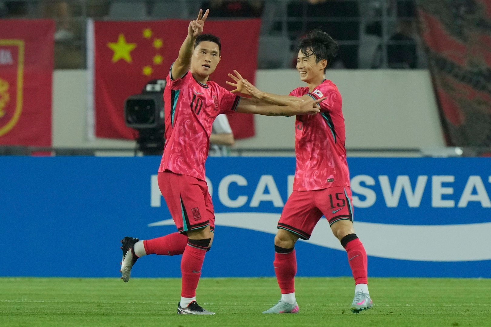 South Korea’s Lee Dong-gyeong (left) celebrates with his teammate Kim Moon-hwan after scoring against China at Yongin Mireu Stadium. Photo: AP