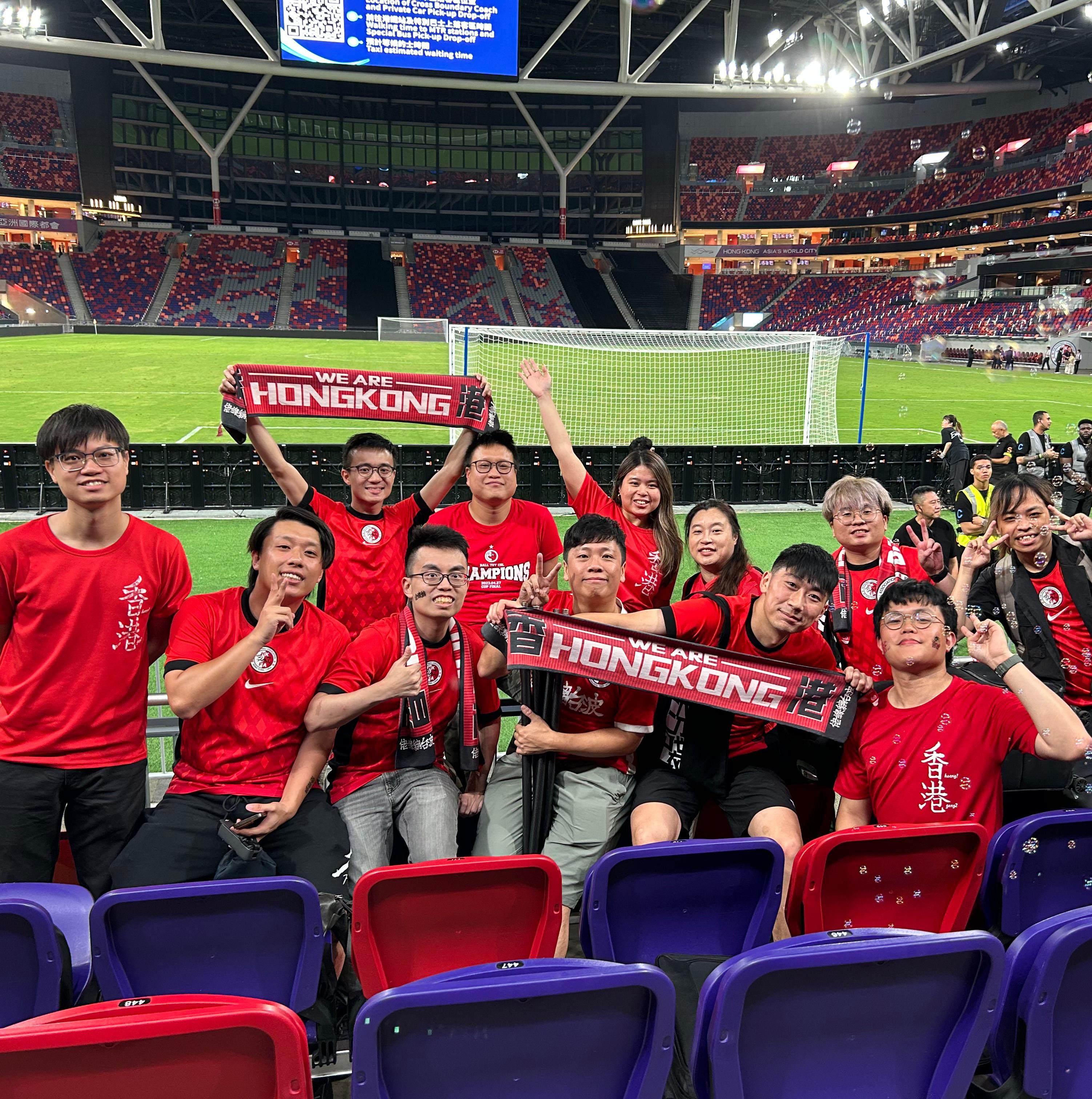 Calvin Choi, seen here on the right holding a scarf, with fellow Chi Sin Lo core members. The group will travel to South Korea to watch Hong Kong in the East Asian Football Championship. Photo: Calvin Choi