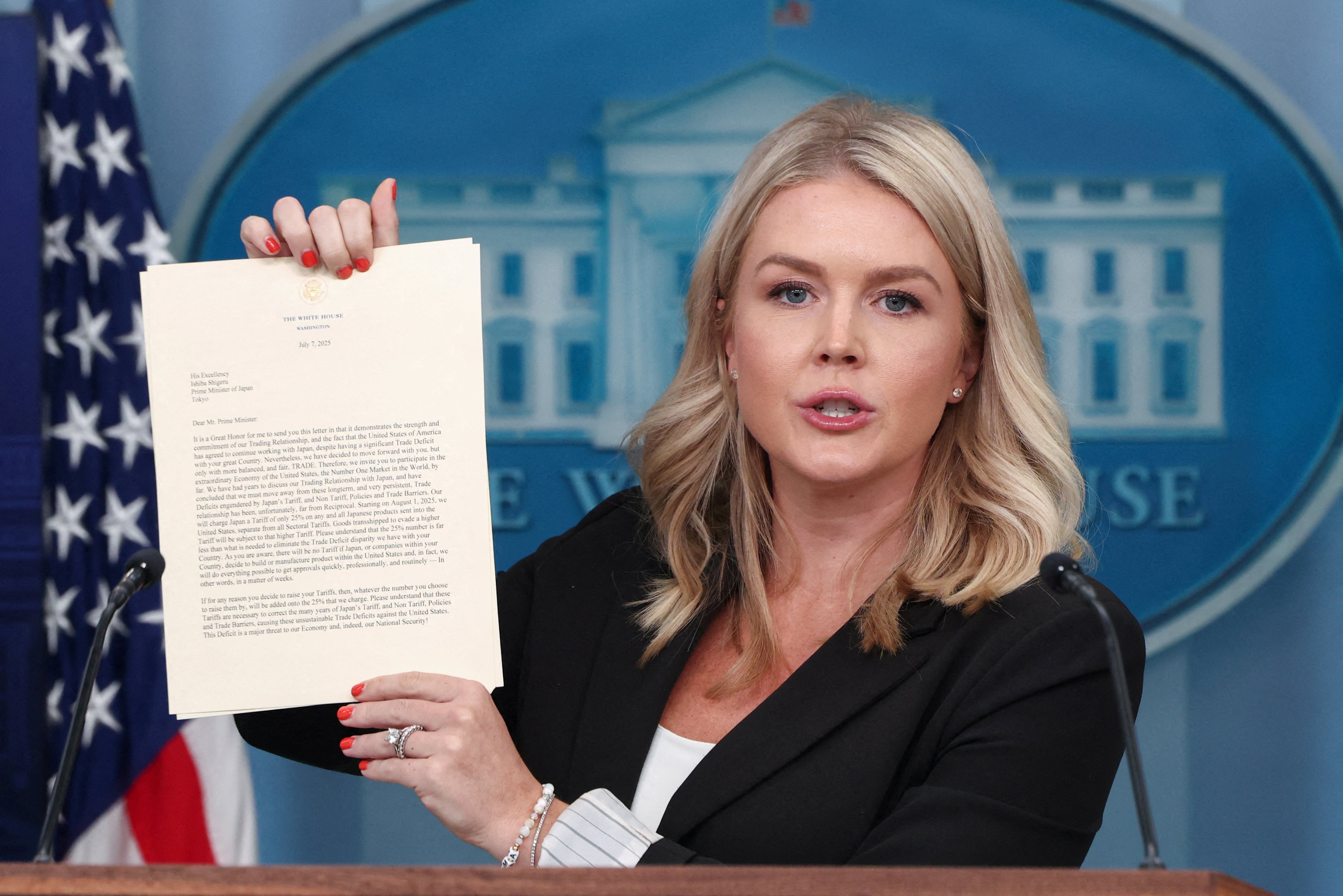 White House Press Secretary Karoline Leavitt shows a letter on tariffs from US President Donald Trump to Japanese Prime Minister Shigeru Ishiba, during a press briefing at the White House Monday. Photo: Reuters