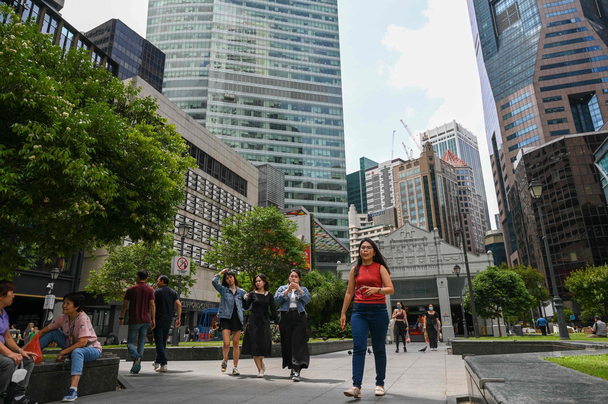 People walking in Raffles Place. About seven in 10 residents in Singapore are currently on integrated shield plans. Photo: AFP People walking in Raffles Place. About seven in 10 residents in Singapore are currently on integrated shield plans. Photo: AFP