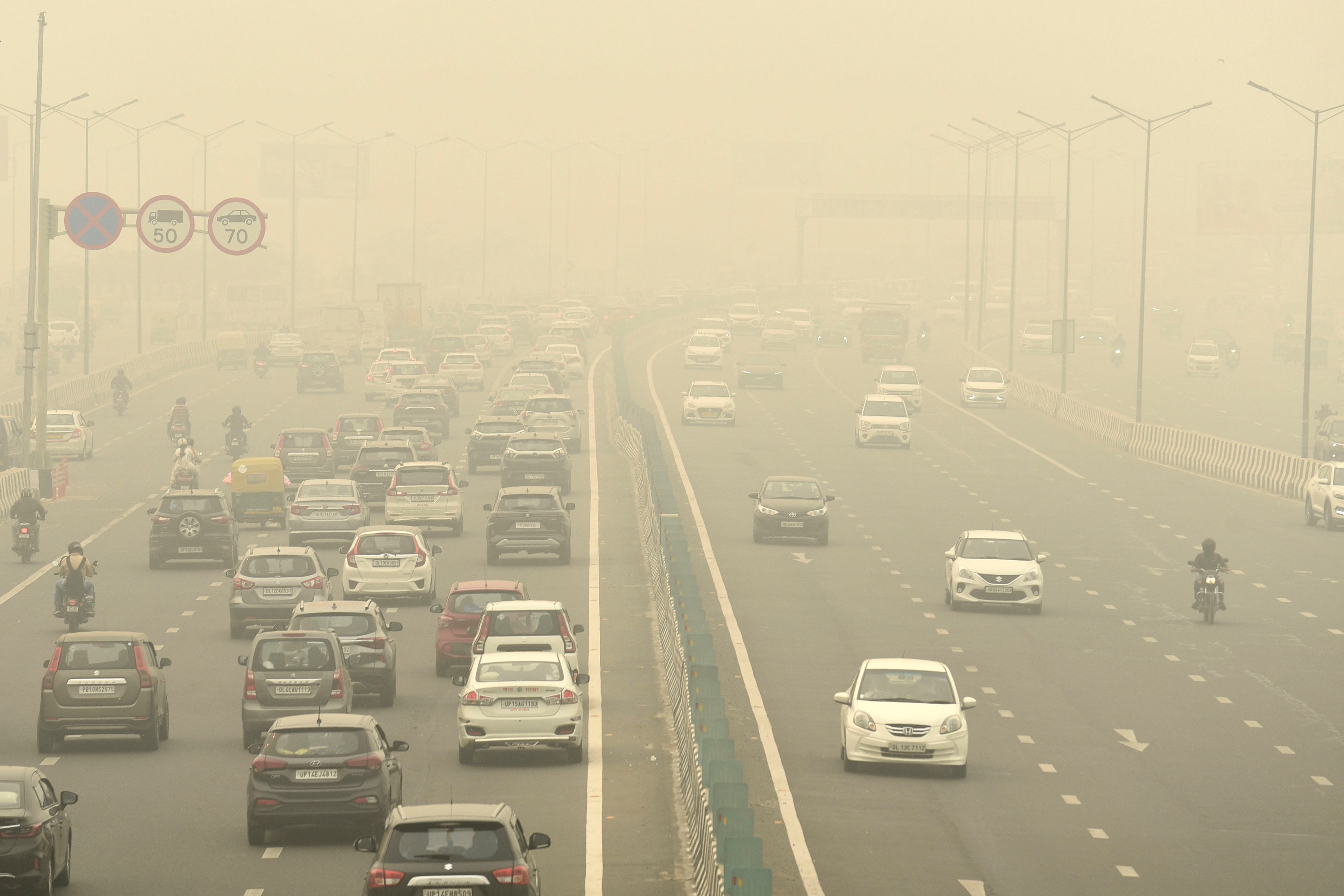 Traffic moves on a road enveloped by fog and smog in New Delhi. India’s capital ranks as one of the most polluted cities globally. Photo: AP