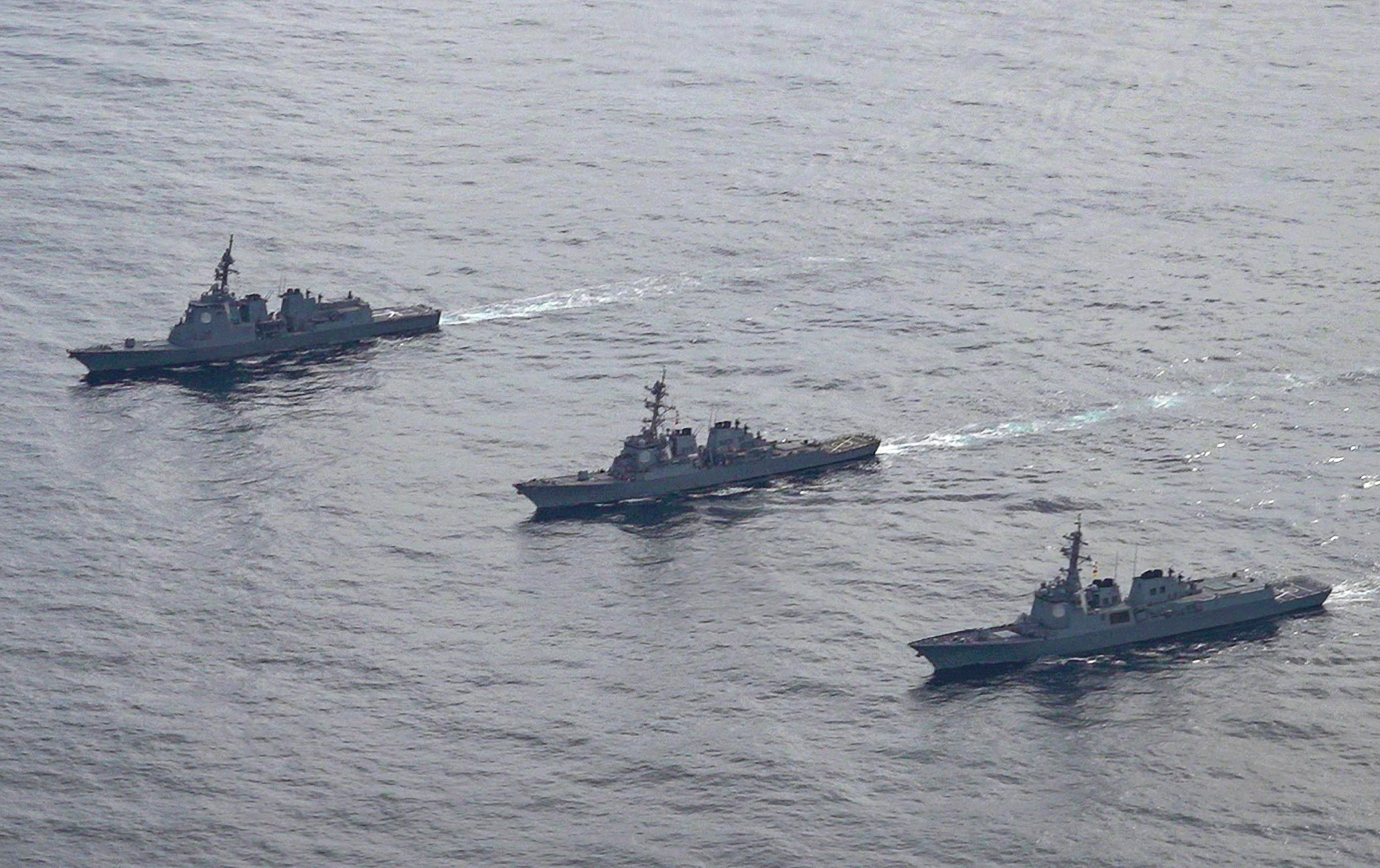Japan, South Korea and the US have looked to strengthen their military partnership in the face of growing threats from North Korea and China’s assertiveness. Pictured are (left to right) the Japan Maritime Self-Defense Force’s destroyer Atago, the US Navy’s Arleigh Burke-class guided-missile destroyer USS Barry and and the South Korean Navy’s Aegis destroyer King Sejong the Great. Photo: South Korea Defence Ministry