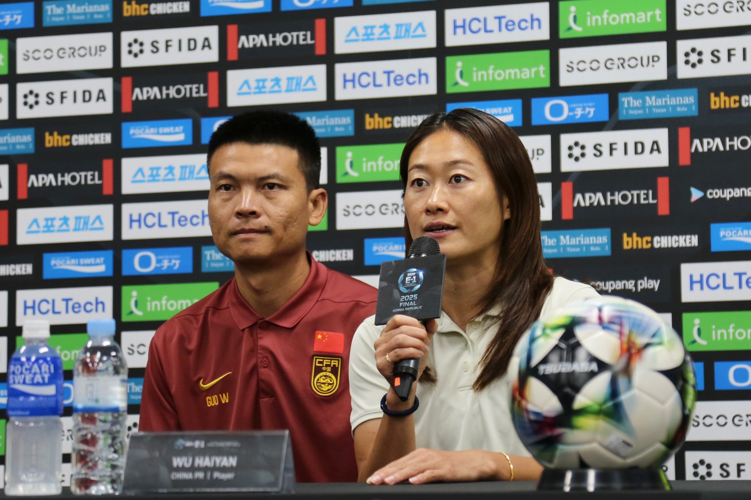 China captain Wu Haiyan (right) speaks during a press conference ahead of her side’s match against South Korea in the East Asian Football Championship. Photo: Xinhua