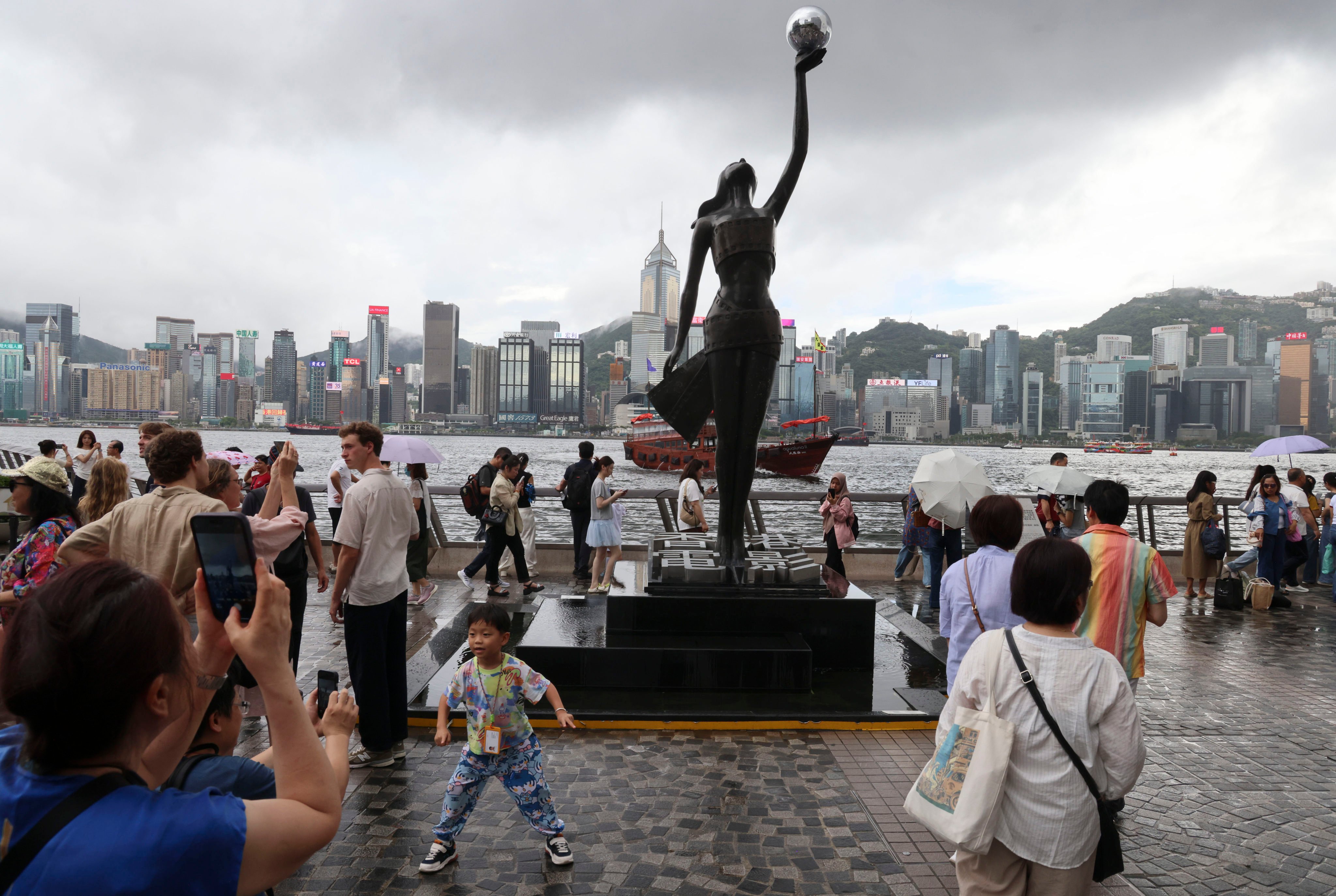 People throng the Tsim Sha Tsui waterfront on the July 1 holiday this year. No doubt New World Development has benefitted from the revitalisation of the promenade, but the project has also created a more vibrant and welcoming waterfront for everyone. Photo: Jelly Tse