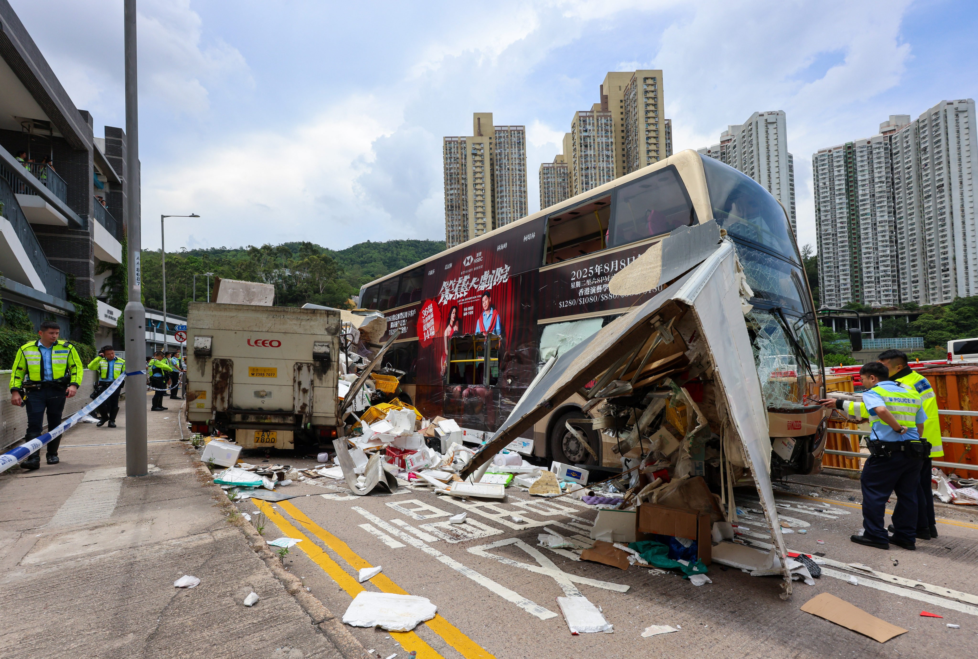 A collision between a bus and a truck on a road in a residential district left 12 people injured. Photo: Jelly Tse