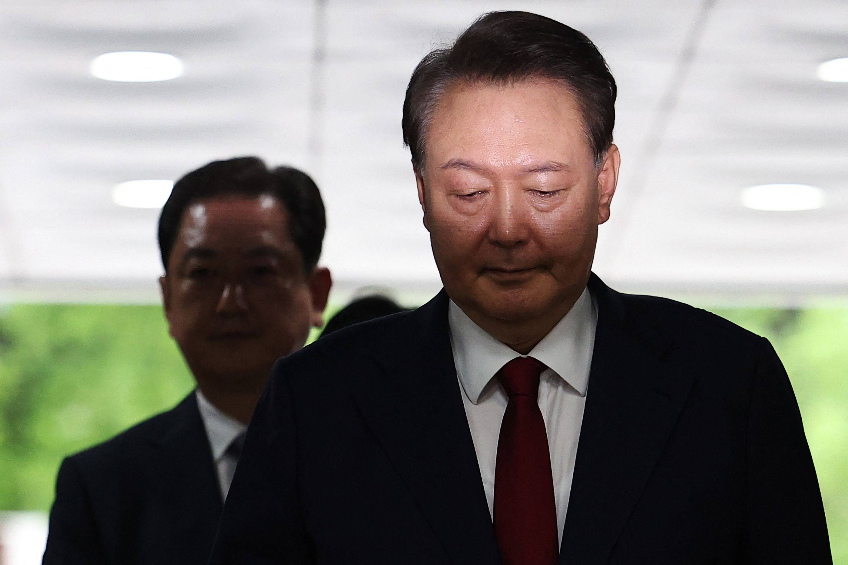 South Korea’s impeached ex-president Yoon Suk-yeol (right) arrives at court on Wednesday to attend a hearing to review his arrest warrant. Photo: AFP