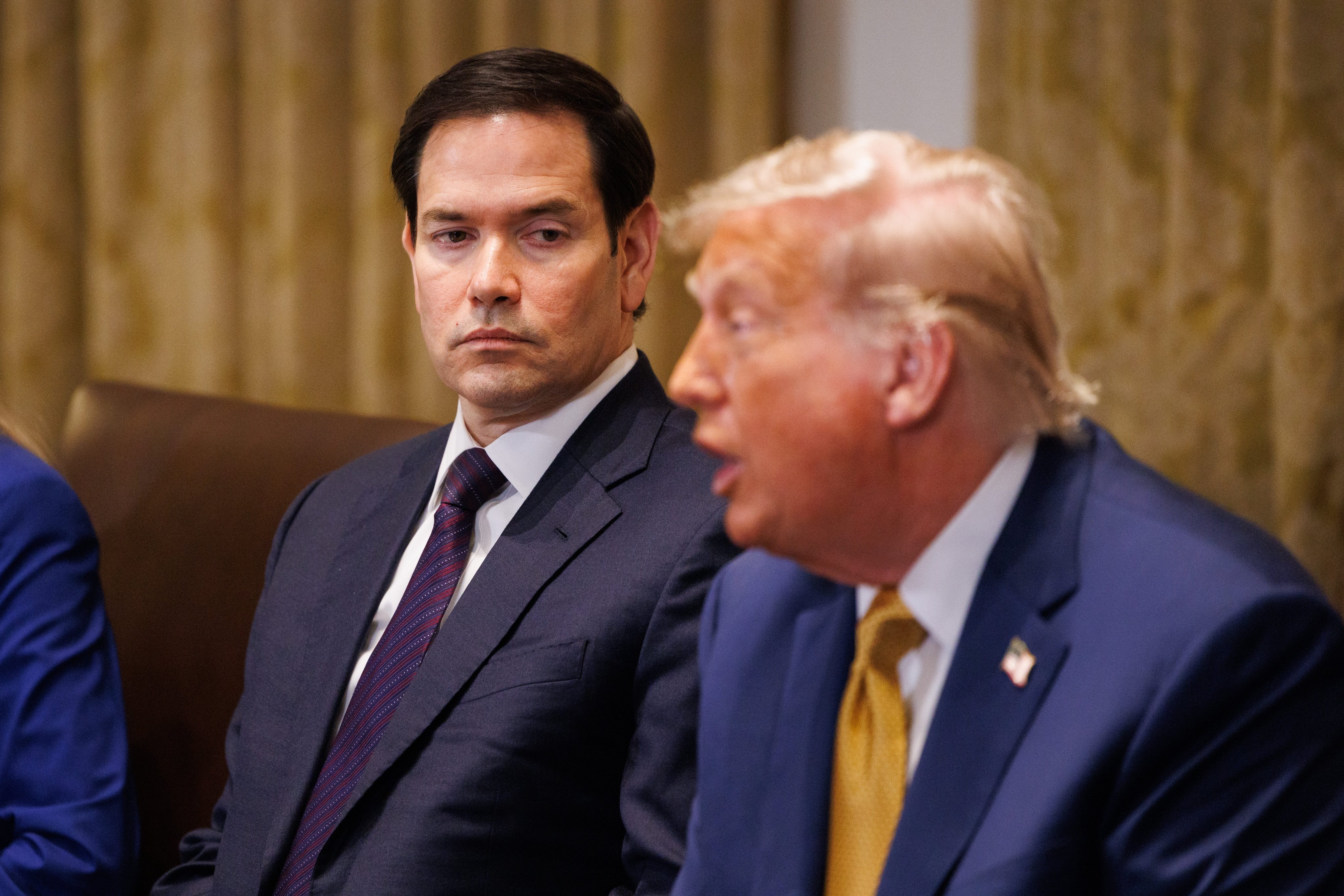US Secretary of State Marco Rubio (left) looks on as President Donald Trump speaks at a cabinet meeting on Tuesday. Photo: EPA