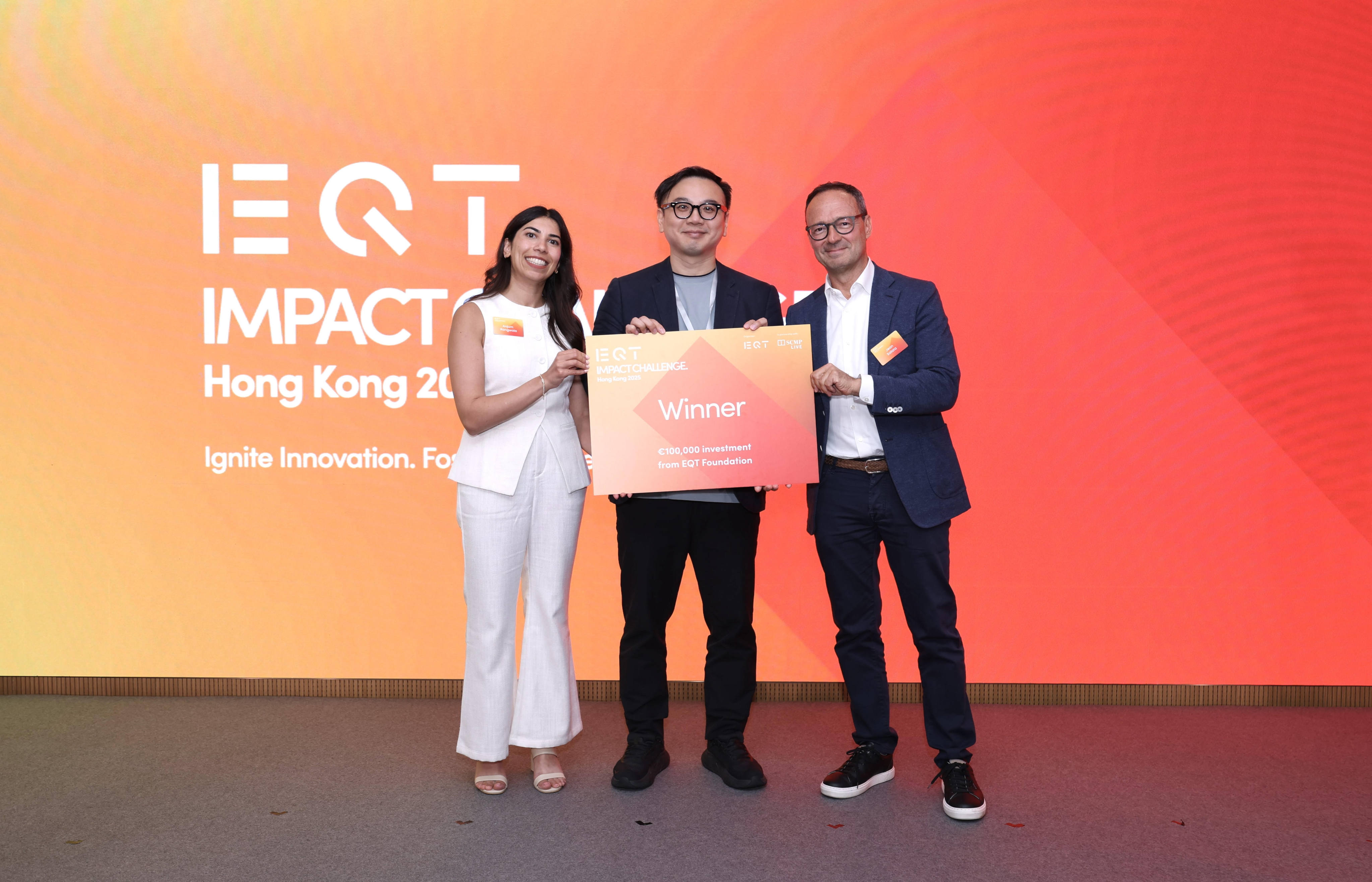 Louis Sze (centre), CEO of Syngular Technology, receives first prize in the 2025 EQT Impact Challenge from EQT Asia’s chairperson Jean Eric Salata (right) and EQT Foundation’s investment lead Anjum Rangwala (left) in Hong Kong on July 10, 2025. Photo: SCMP