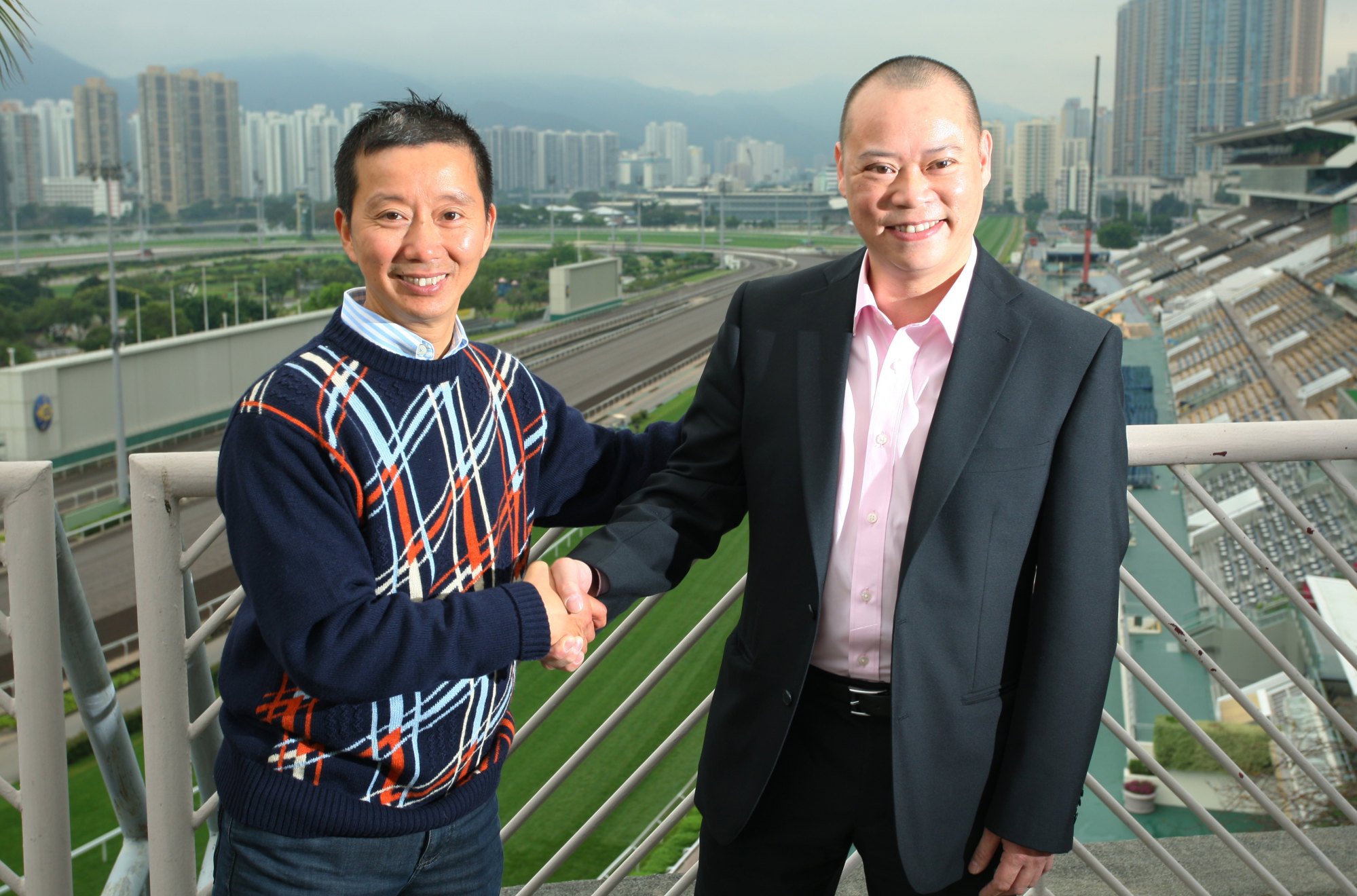 Benno Yung (left) and Chris So pose for the press after being announced as new trainers in 2013.