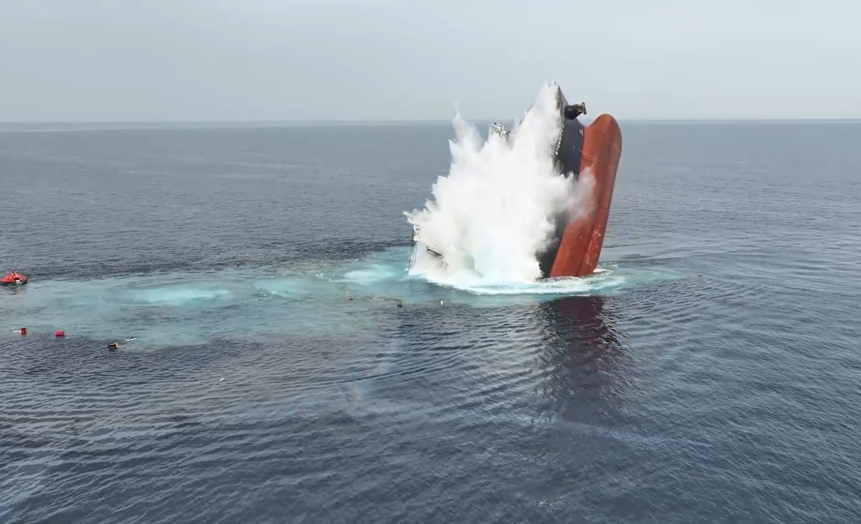 The Liberian-flagged bulker, Eternity C, sinking after being attacked in the Red Sea off the coast of Yemen. Photo: Houthis Military Media via EPA