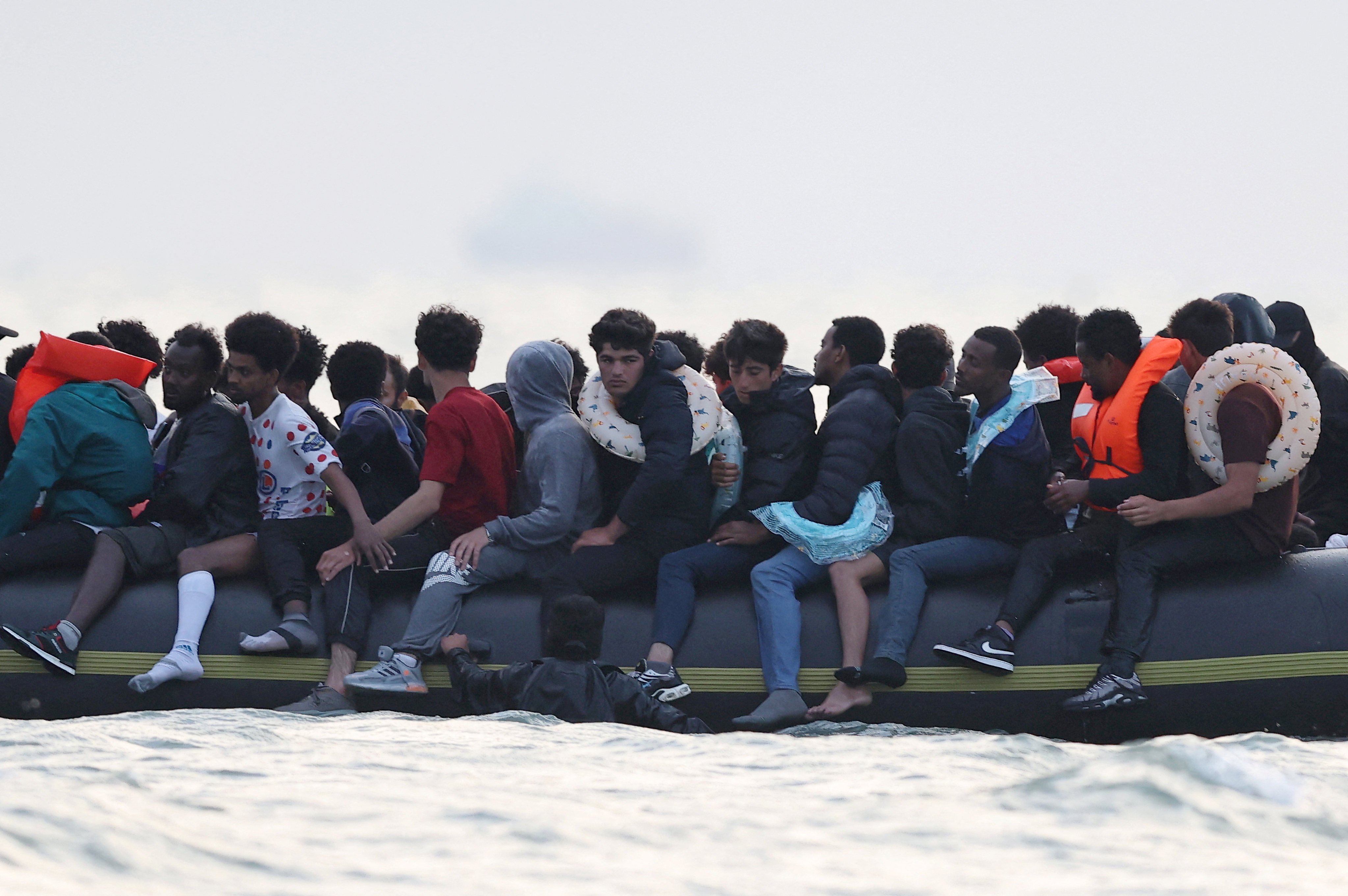A group of migrants on an inflatable dinghy leave the coast of northern France in an attempt to cross the English Channel to reach Britain on July 2. Photo: Reuters