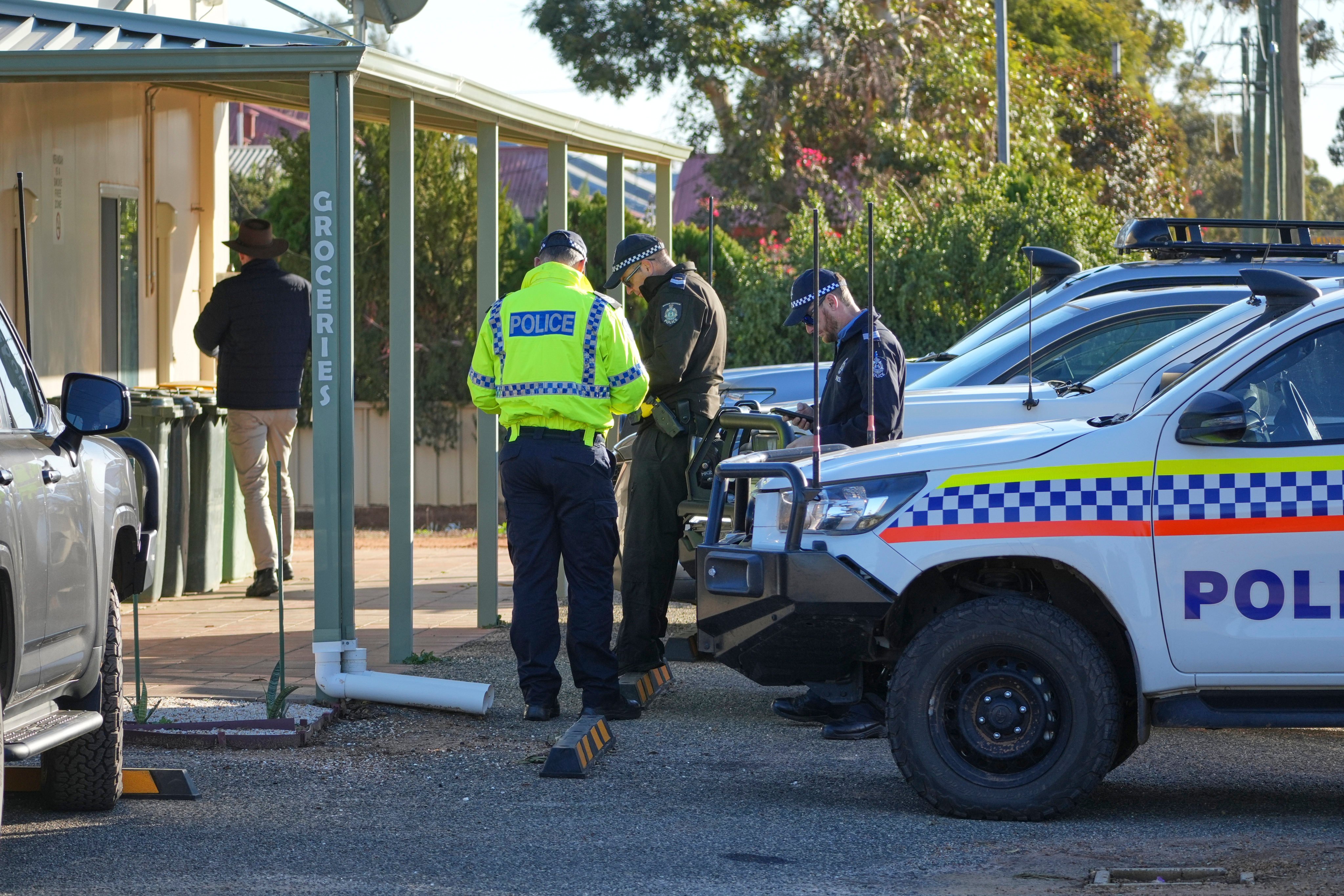 Police officers gather in Beacon, Western Australia on Friday as they prepare to search for missing German backpacker Carolina Wilga. Photo: via AP