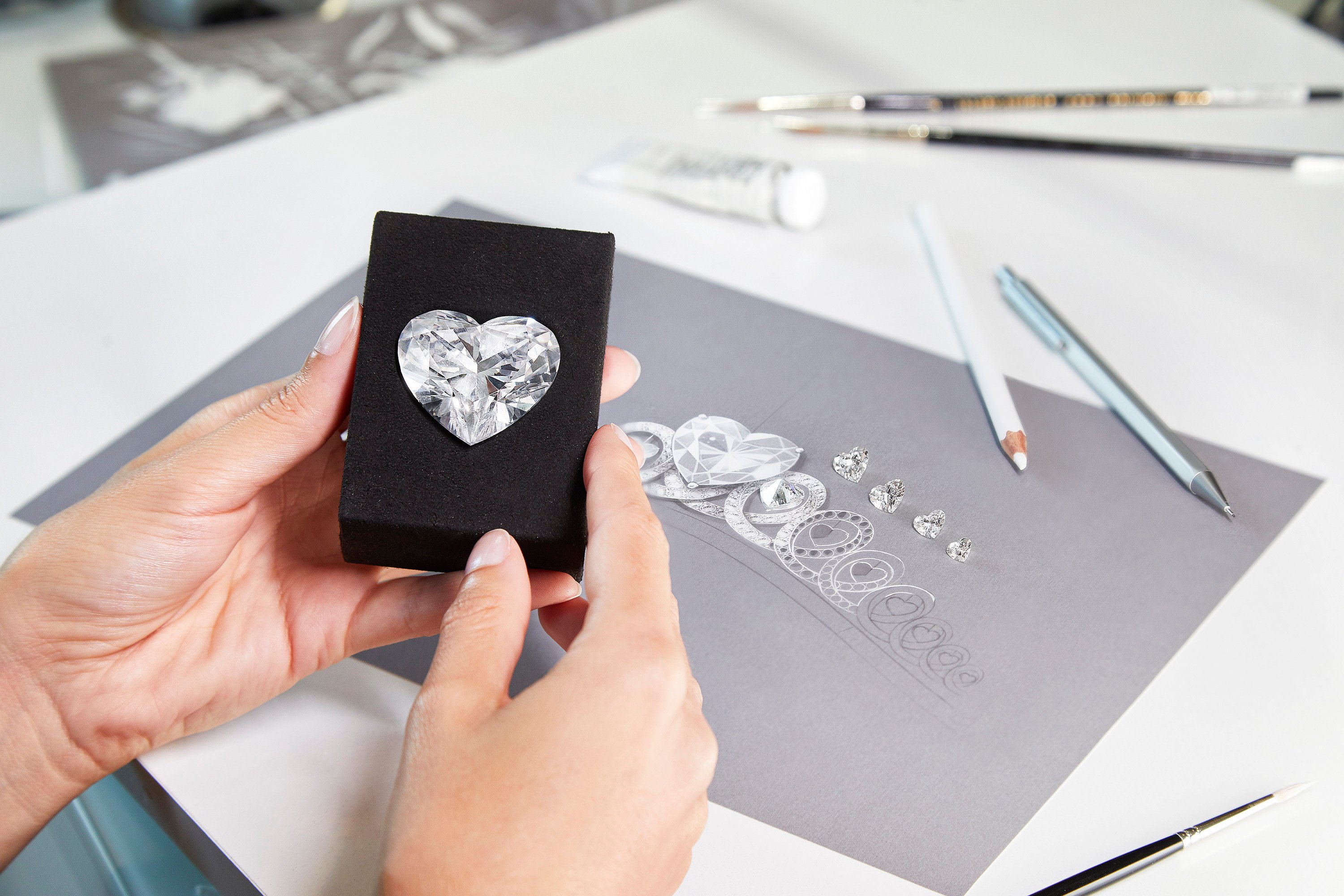 A legend in the making: Graff’s record-breaking 157.8-carat Infinity diamond, alongside a design sketch of the magnificent tiara for which it is destined to become the centrepiece. Photo: Handout