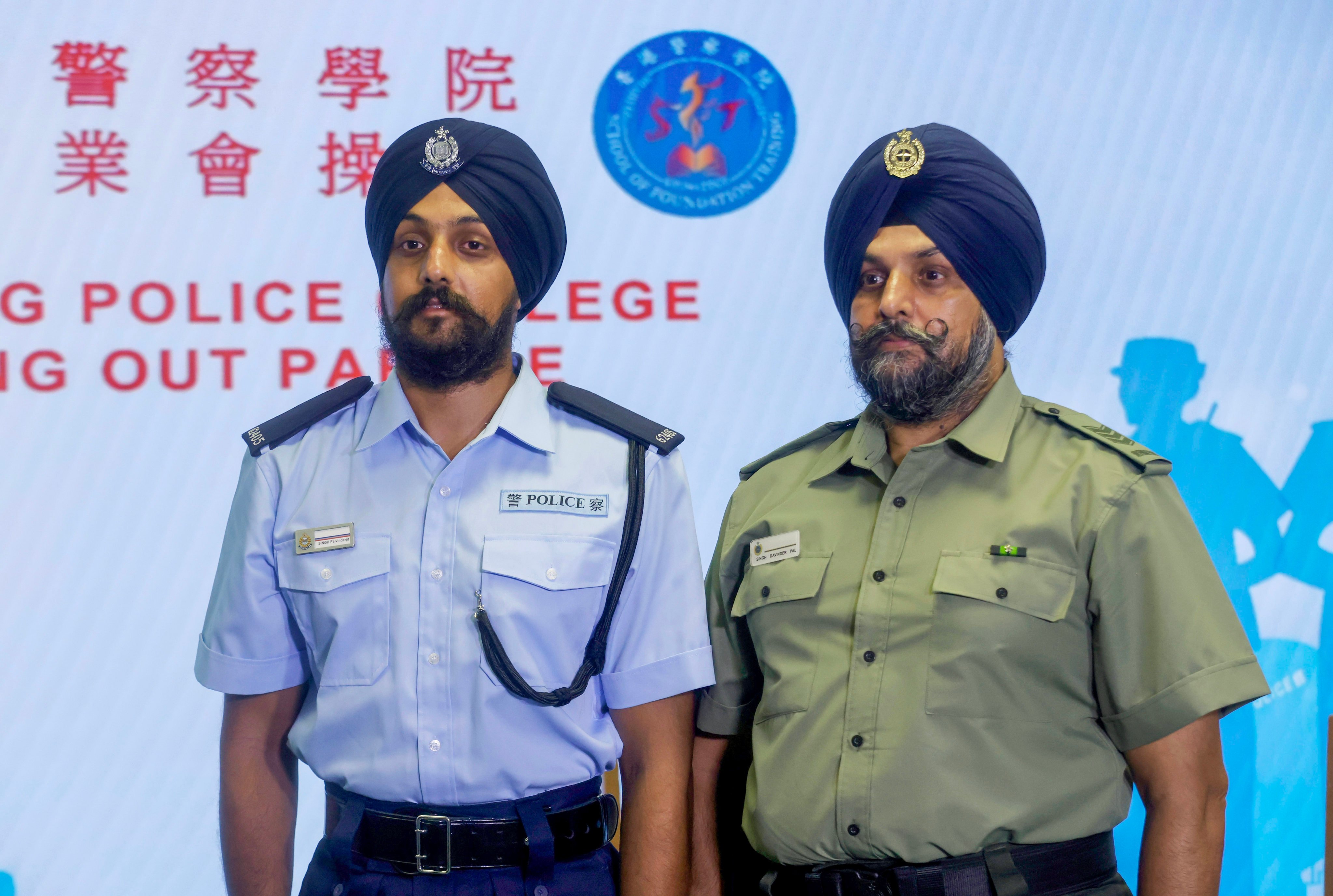 Police constable Palvinderjit Singh (left) and his father Davinder-pal Singh, an assistant officer with the Correctional Services Department, at Police College. Photo: Jonathan Wong