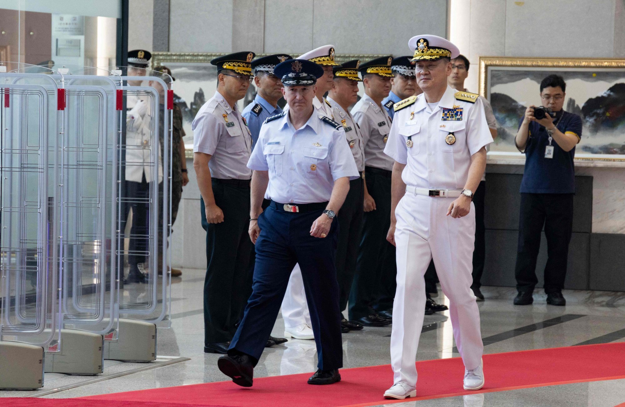 US Chairman of the Joint Chiefs of Staff Air Force General Dan Caine (left) and Admiral Kim Myung-soo, chairman of South Korea’s Joint Chiefs of Staff, inspect a guard of honour at the Ministry of National Defence in Seoul on Thursday. Photo: AFP US Chairman of the Joint Chiefs of Staff Air Force General Dan Caine (left) and Admiral Kim Myung-soo, chairman of South Korea’s Joint Chiefs of Staff, inspect a guard of honour at the Ministry of National Defence in Seoul on Thursday. Photo: AFP
