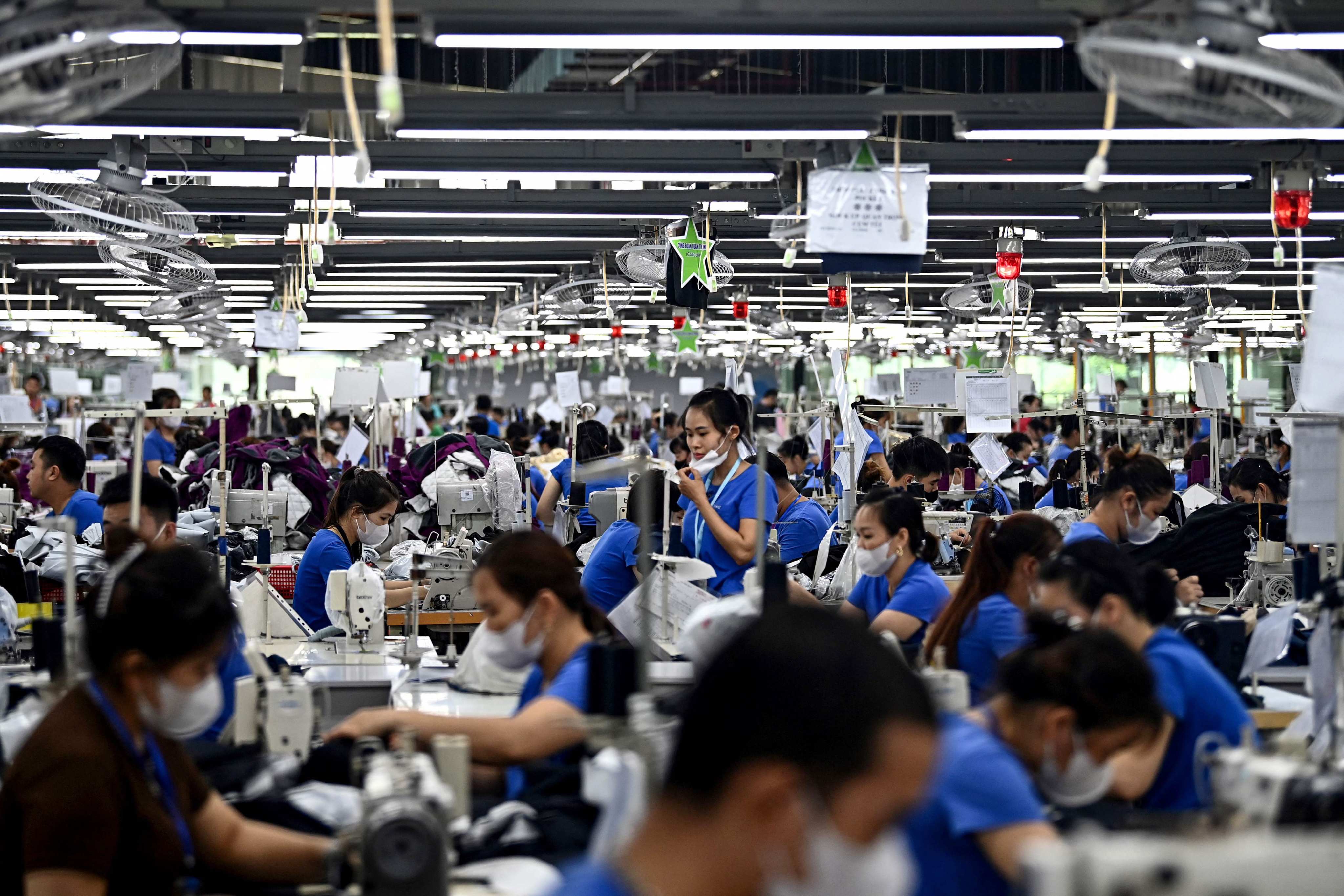 Workers stitch garments at a factory in Vietnam’s Thai Nguyen province on July 2. Photo: AFP