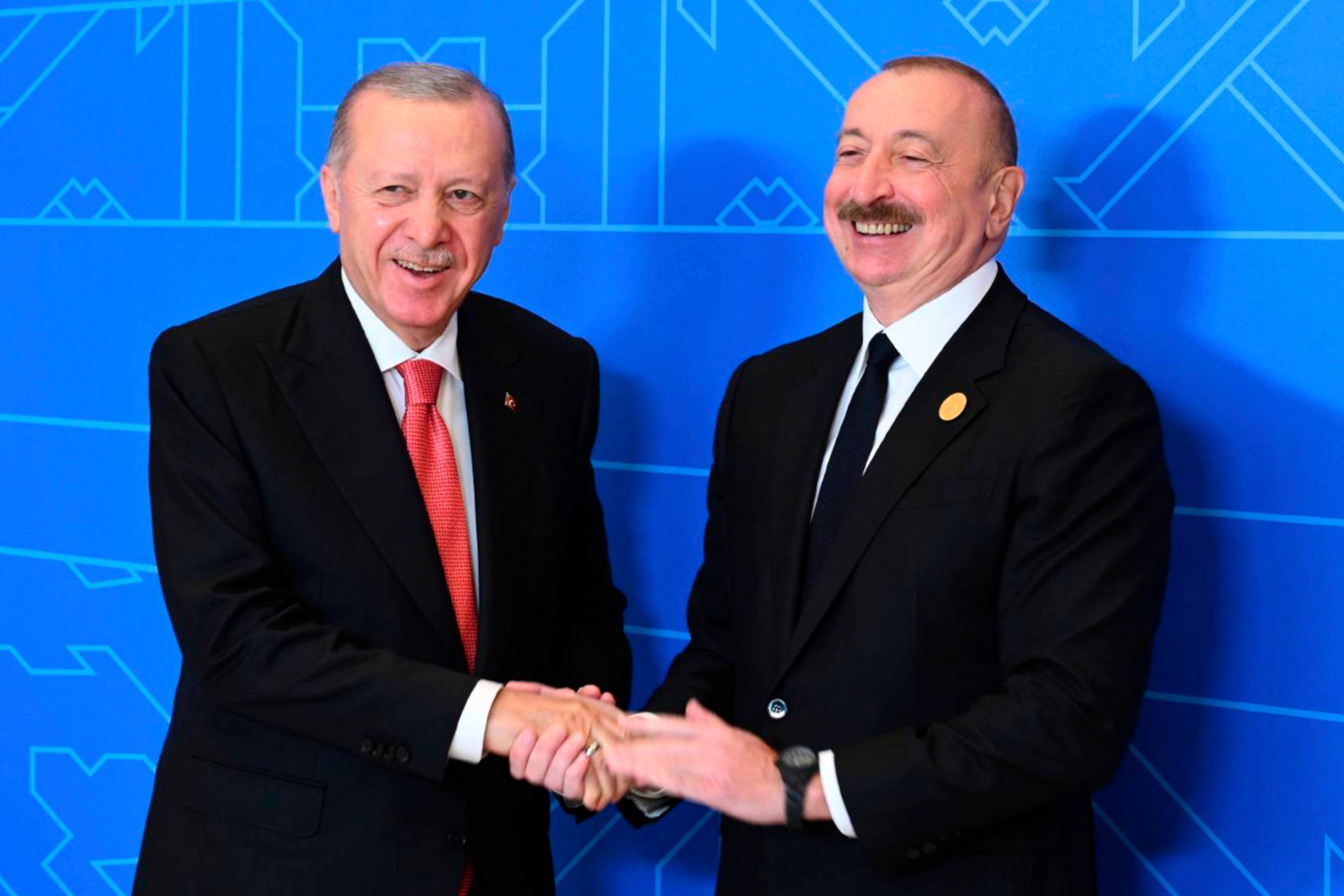 Azerbaijani President Ilham Aliyev (right) with Turkish President Recep Tayyip Erdogan during their meeting on the sidelines of the 17th Summit of the Economic Cooperation Organization in Azerbaijan on July 4. Photo: Azerbaijani Presidential Press Office/AP
