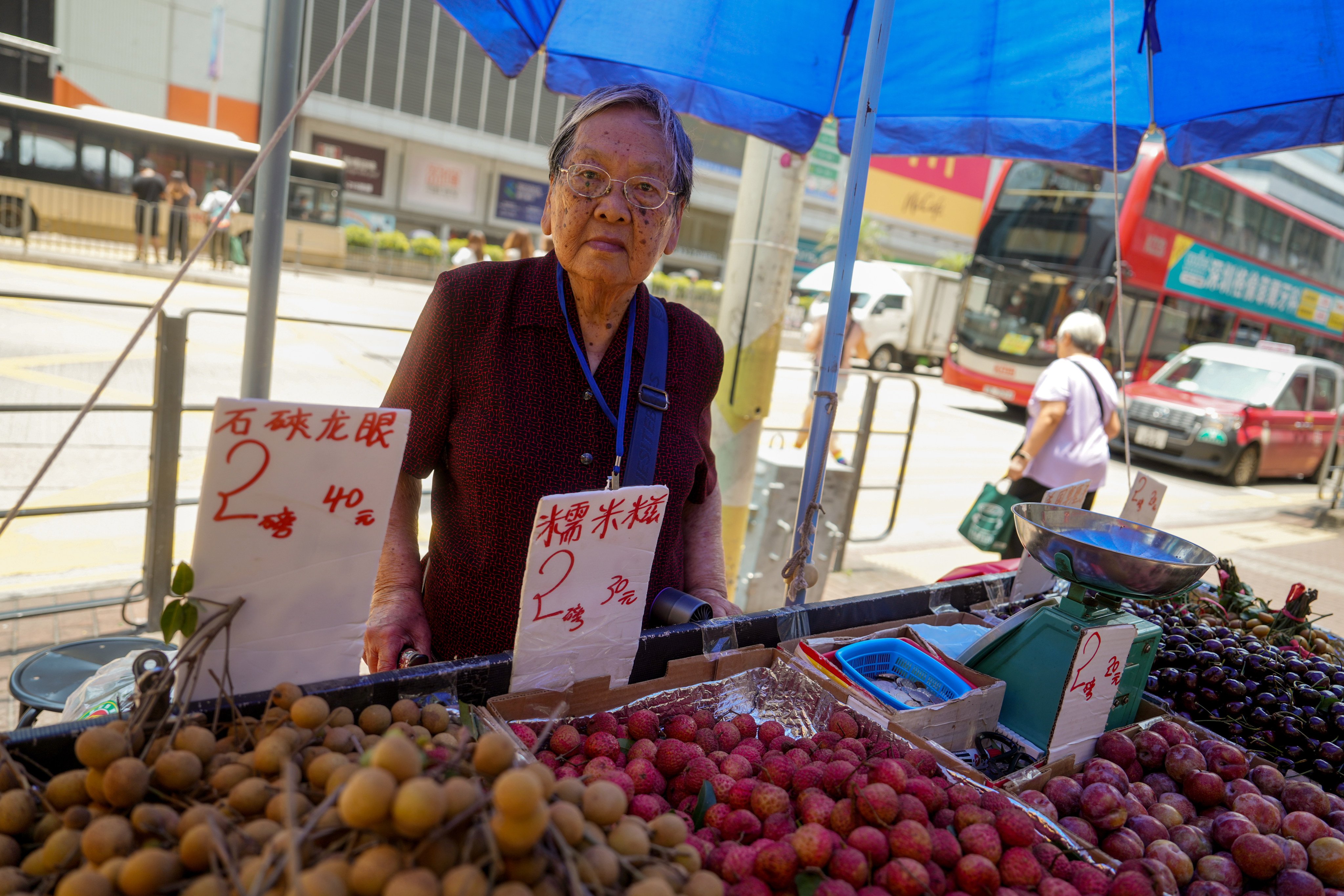 Hawker licence holder Chan Tak-ching tends to her stall at Lai Chi Kok. Photo: Sun Yeung