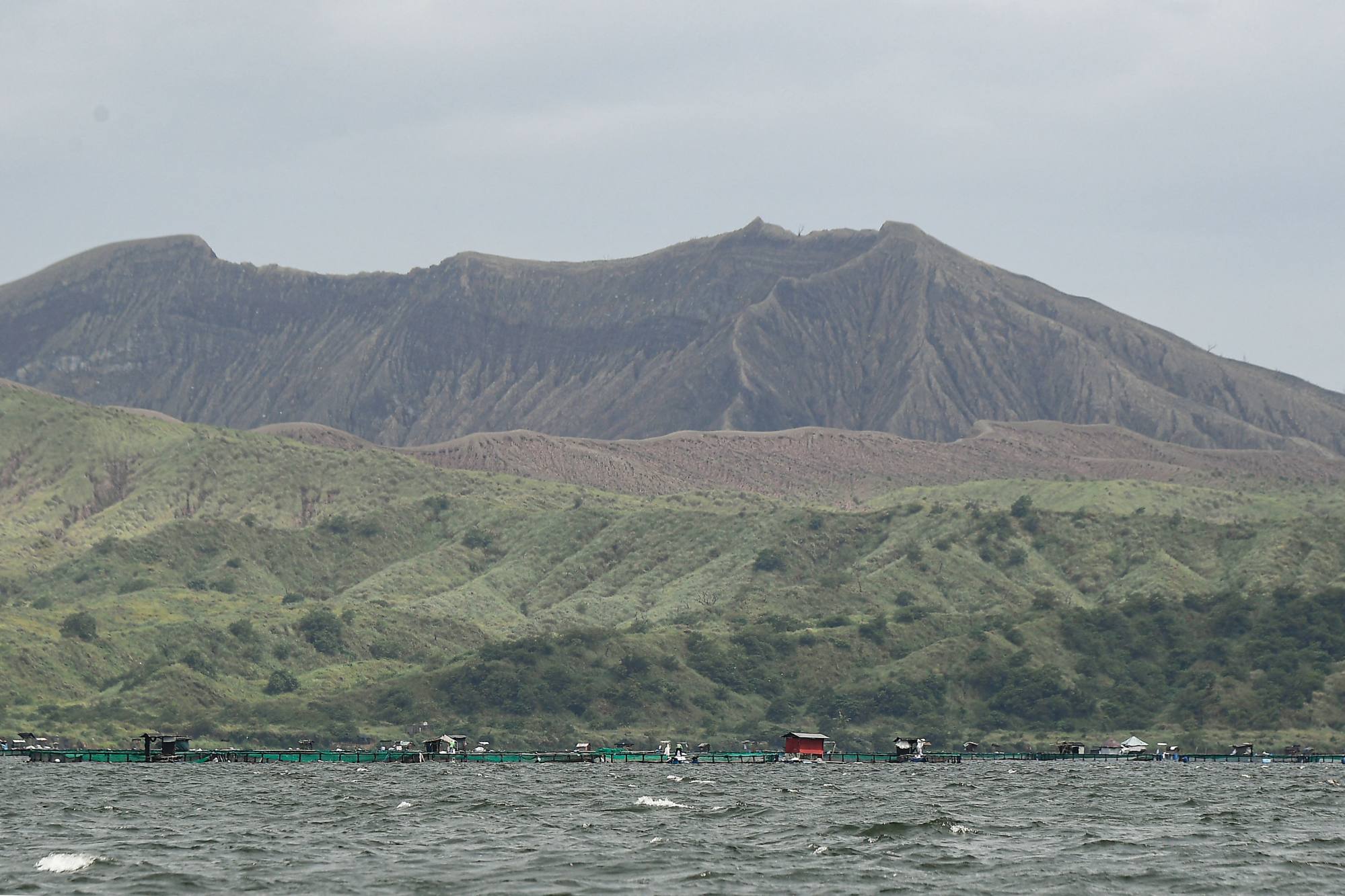 The Taal volcano crater with fish cages (bottom), seen along Taal Lake off Laurel town, Batangas province, south of Manila, on Thursday. Taal is a popular tourist spot in the Philippines. Photo: AFP