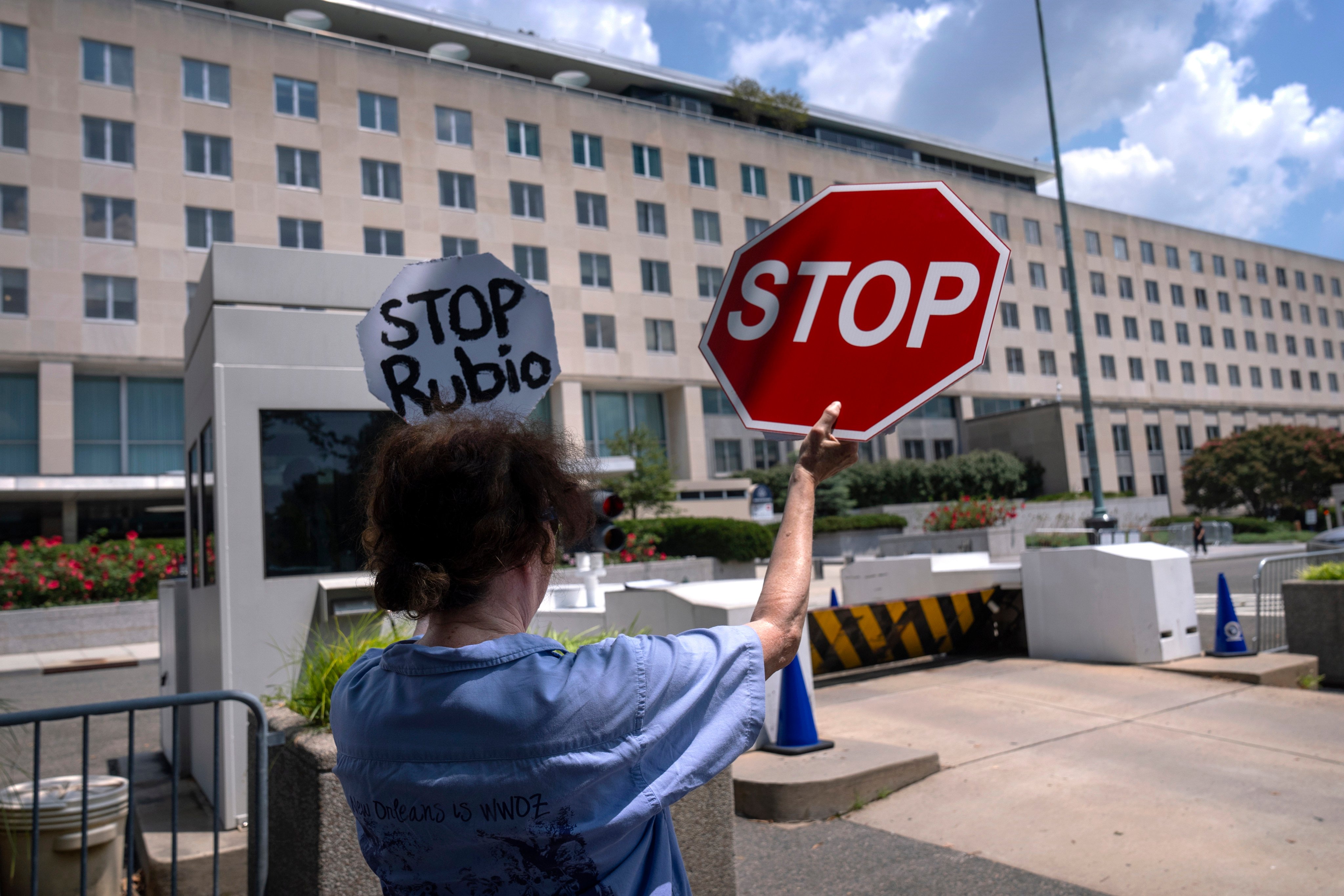 A former Foreign Service employee demonstrates against potential lay-offs at the US State Department on Friday. Photo: AP