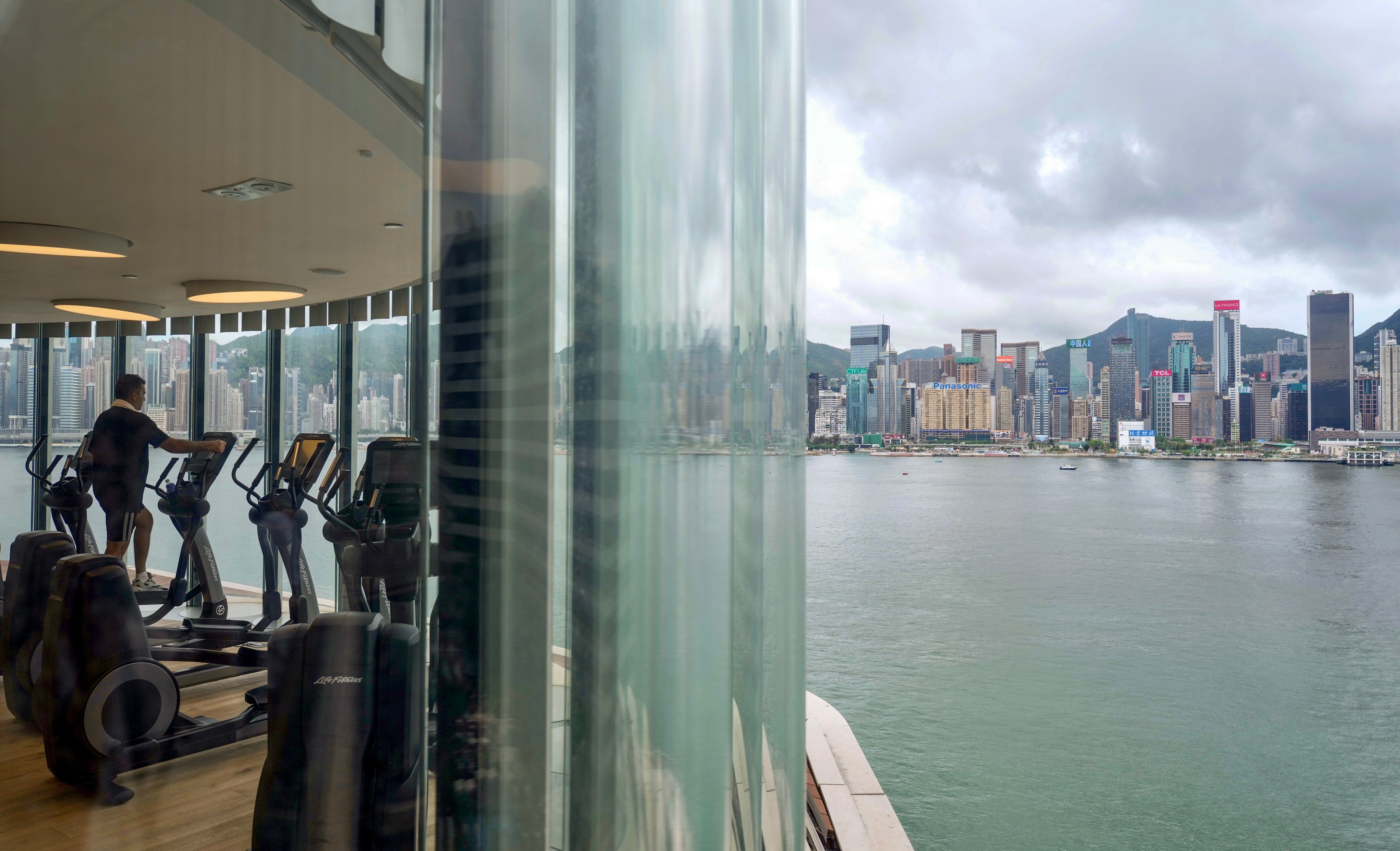 A man exercises in a hotel on the waterfront in Tsim Sha Tsui. Photo: Sam Tsang