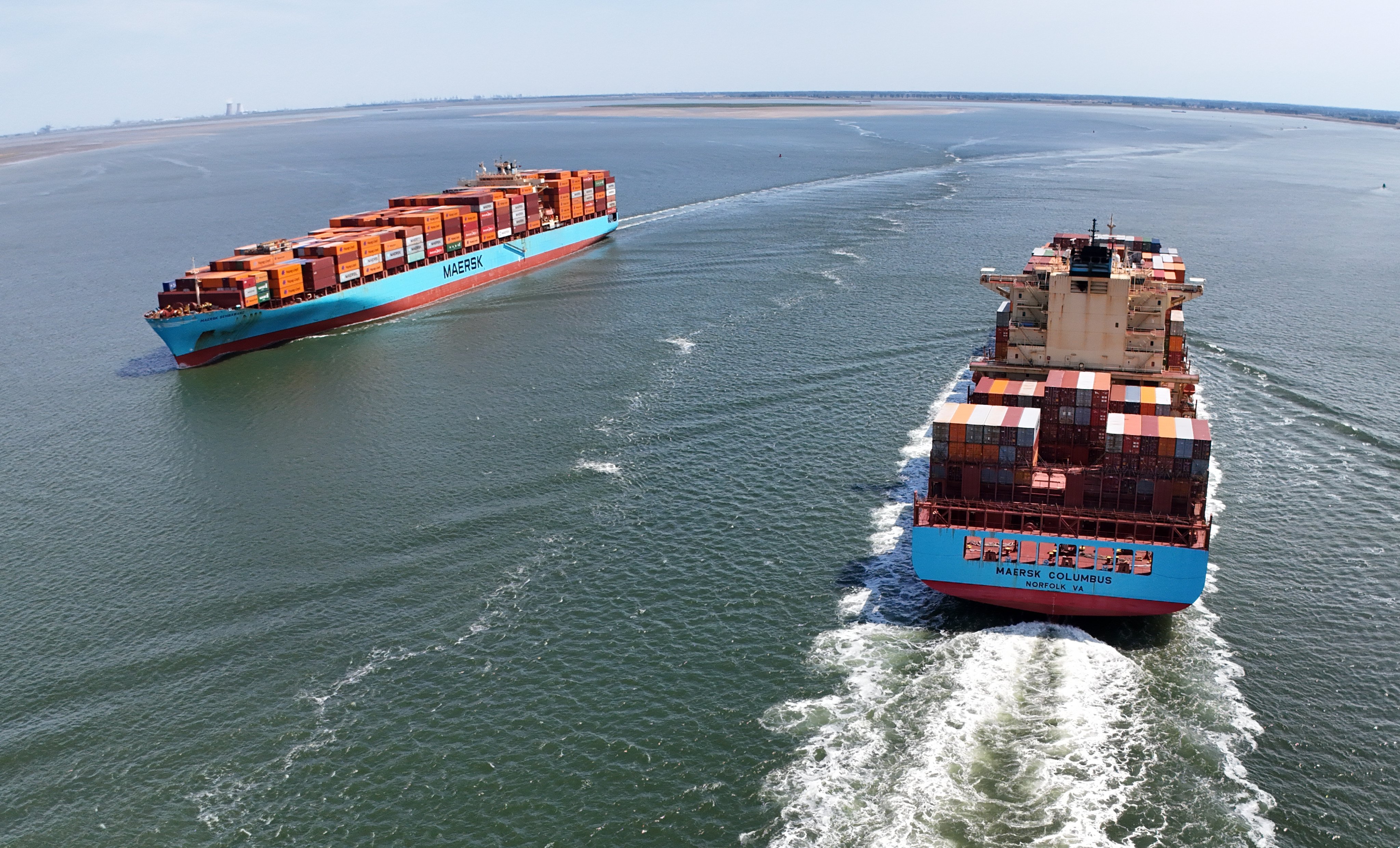 Container ships moving Norfolk harbour in the US and Antwerp harbour in the Netherlands. Photo: EPA-EFE
