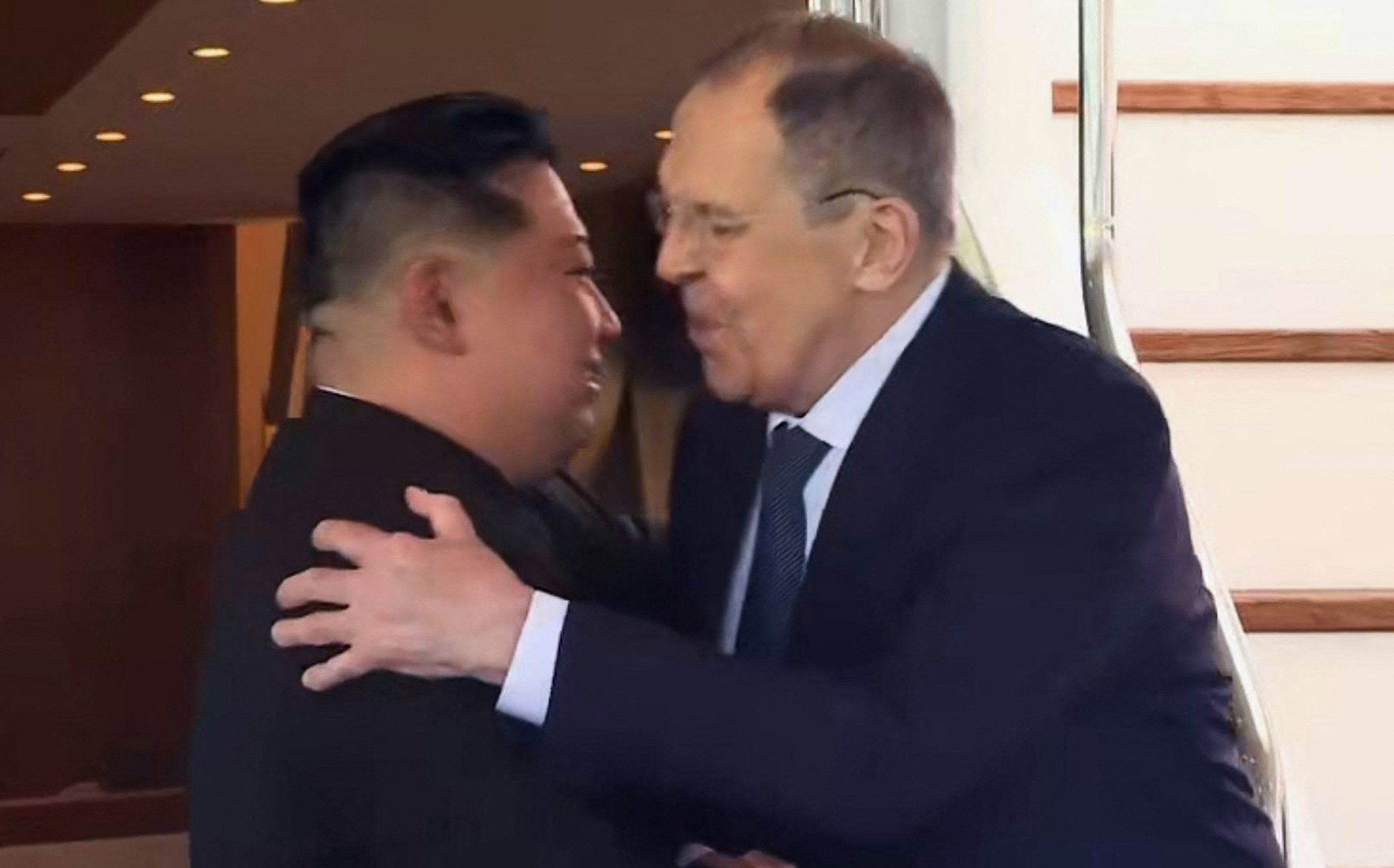 Russian Foreign Minister Sergey Lavrov hugs North Korean leader Kim Jong-un in Wonsan on Saturday. Photo: Russian foreign ministry via AFP