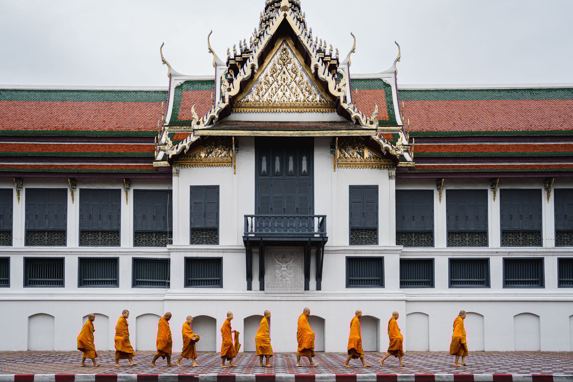 Buddhist monks walk along Wat Phra Kaew barefoot to receive morning alms as part of the daily ritual in Bangkok. Photo: DPA Buddhist monks walk along Wat Phra Kaew barefoot to receive morning alms as part of the daily ritual in Bangkok. Photo: DPA