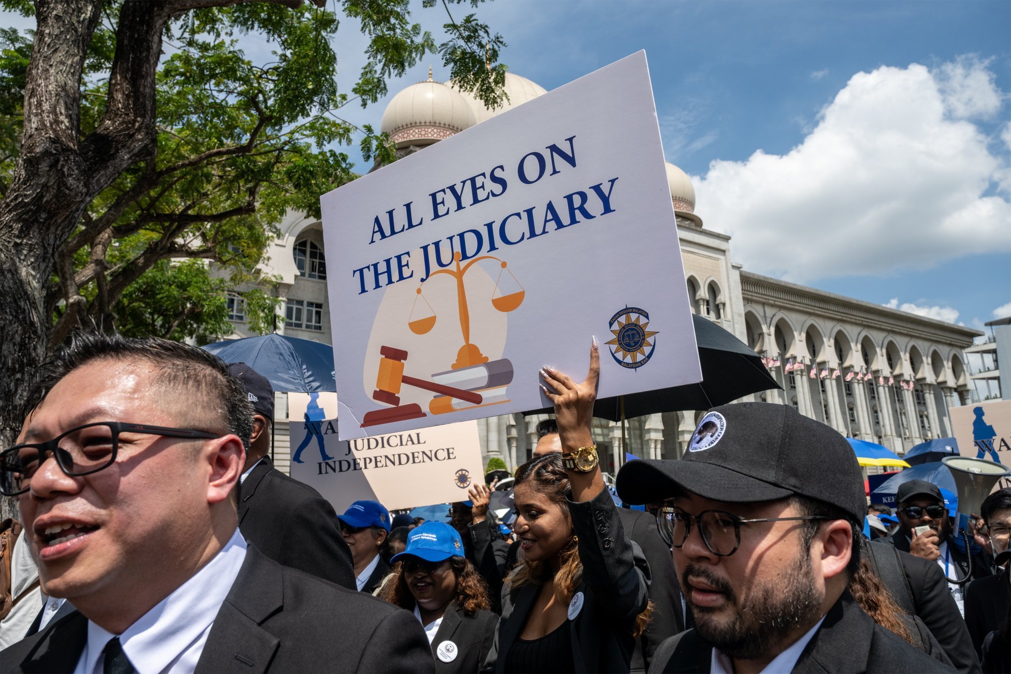 Lawyers and trainee lawyers hold placards as they march to the prime minister’s office in Putrajaya, Malaysia, on Monday calling for judicial independence. Photo: EPA Lawyers and trainee lawyers hold placards as they march to the prime minister’s office in Putrajaya, Malaysia, on Monday calling for judicial independence. Photo: EPA