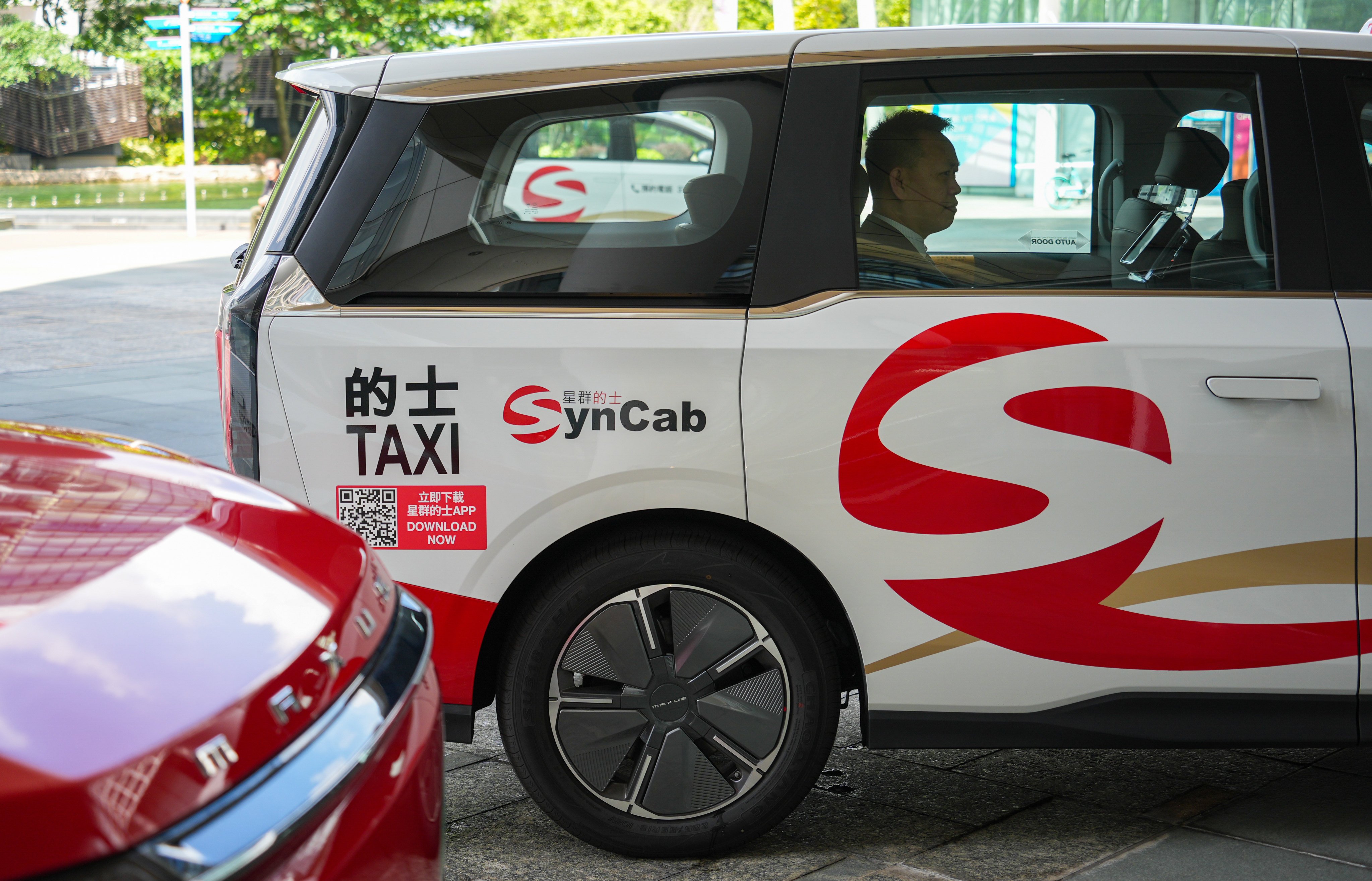 SynCab is one of five providers selected by authorities to operate the fleets. Photo: Eugene Lee