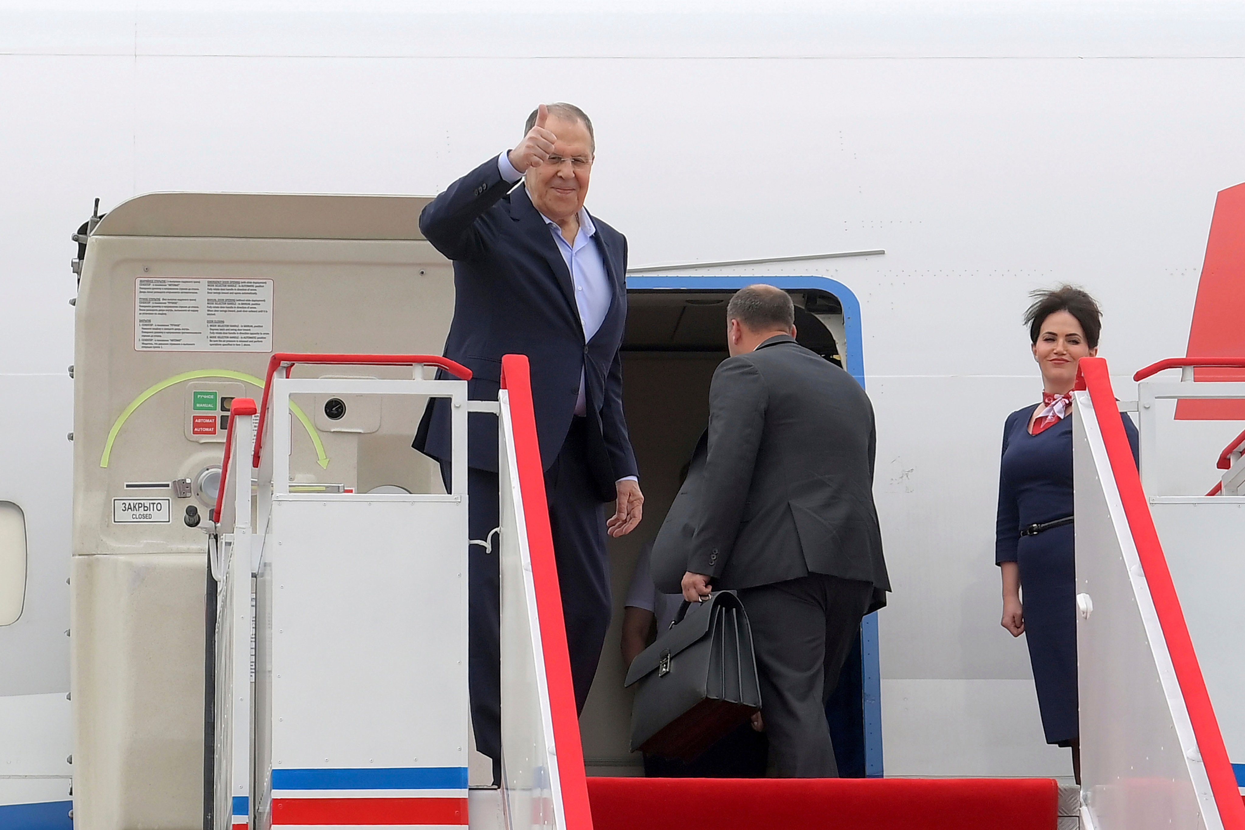 Russian Foreign Minister Sergey Lavrov gives a thumbs up as he prepares to depart from North Korea’s Wonsan Kalma Airport on Sunday. Photo: KCNA/KNS/AP