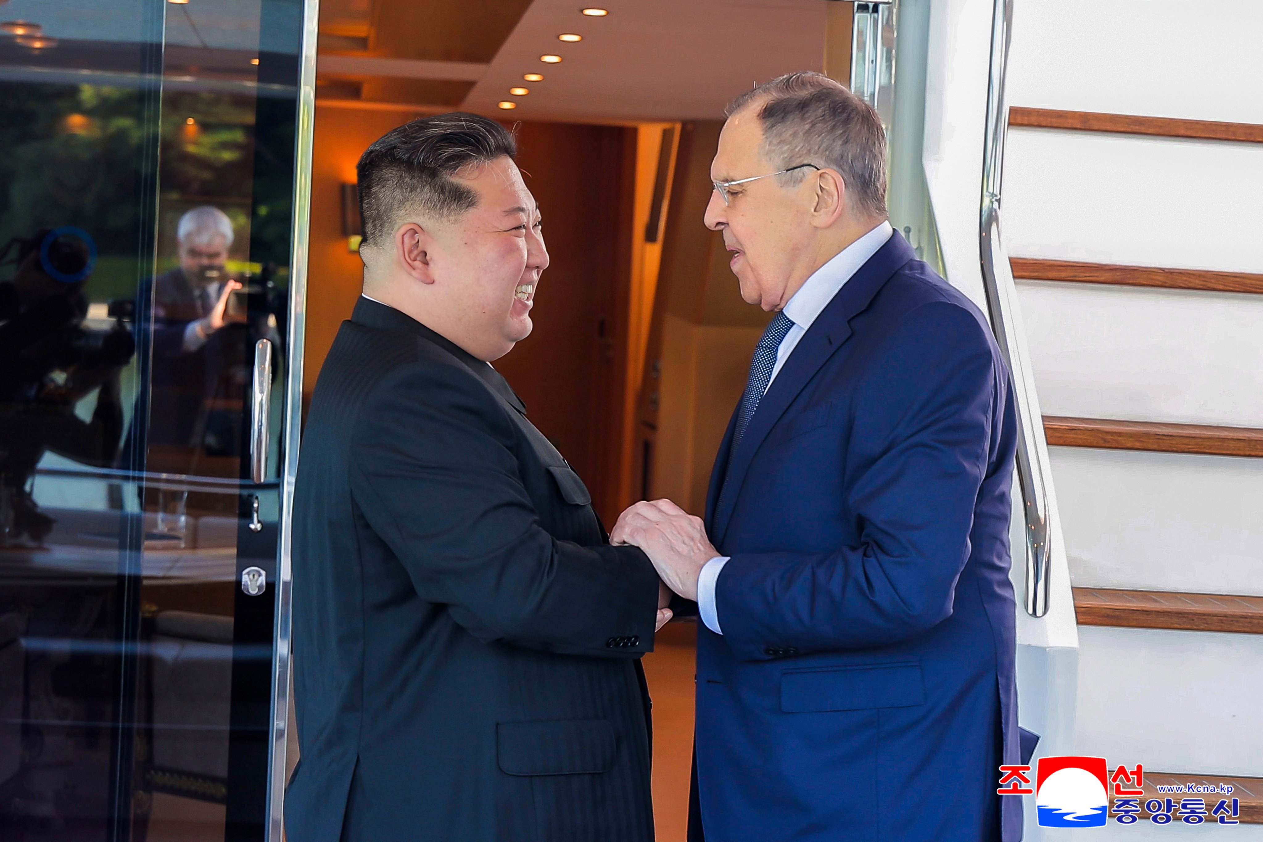 North Korean leader Kim Jong-un (left) greets Russian Foreign Minister Sergey Lavrov during a meeting in Wonsan, North Korea, on Saturday. Photo: KCNA/EPA
