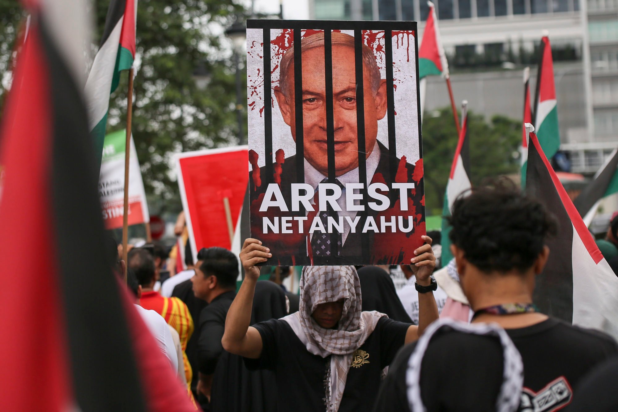 A protester in Kuala Lumpur holds a placard reading “Arrest Netanyahu” during a rally held last month in solidarity with Palestinians. Photo: Sopa Images via Zuma Press Wire/dpa A protester in Kuala Lumpur holds a placard reading “Arrest Netanyahu” during a rally held last month in solidarity with Palestinians. Photo: Sopa Images via Zuma Press Wire/dpa