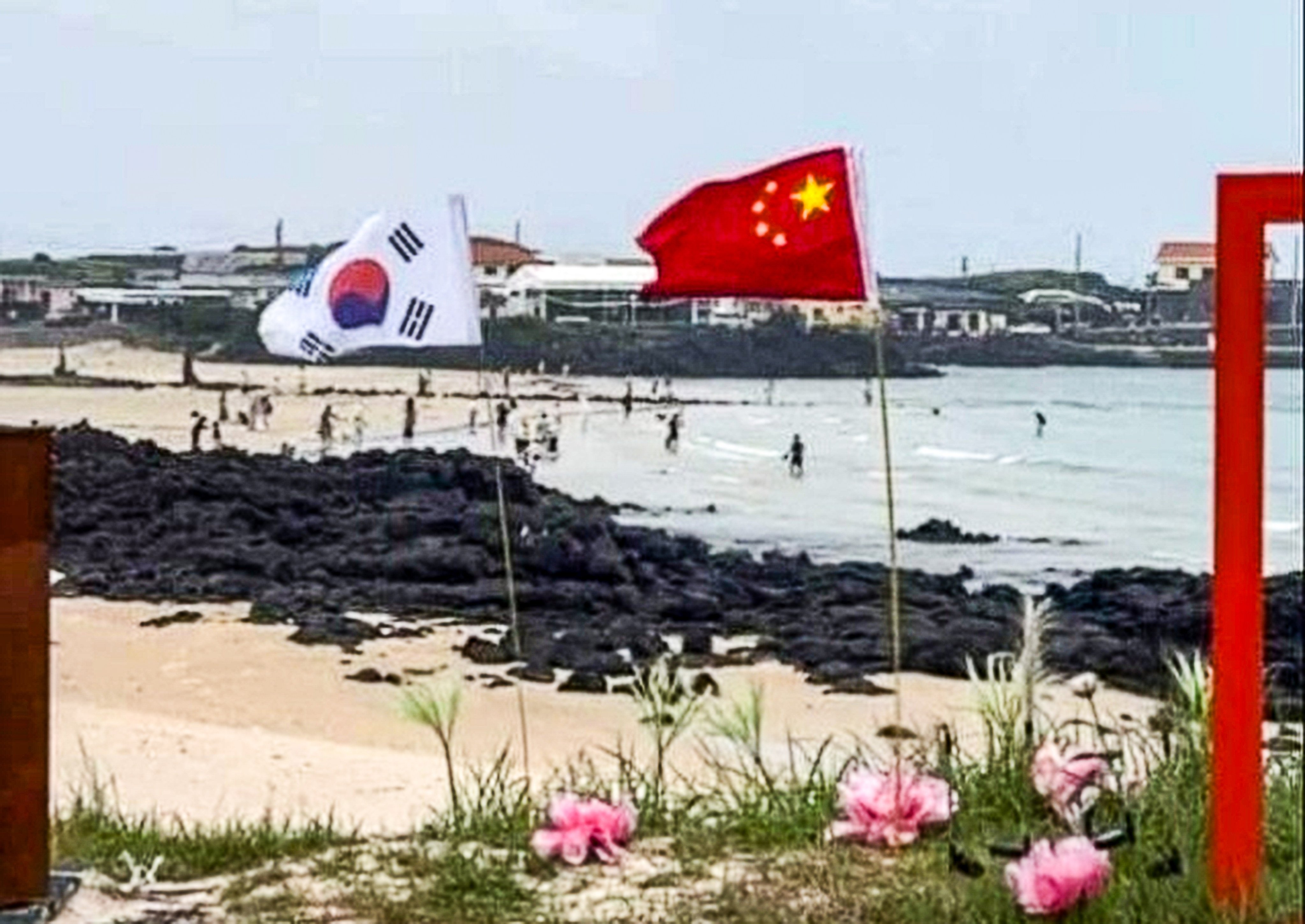 An incident on Udo Island, Jeju Province, sparked backlash after the Chinese national flag was displayed alongside the South Korean flag on a beach road. Photo: handout