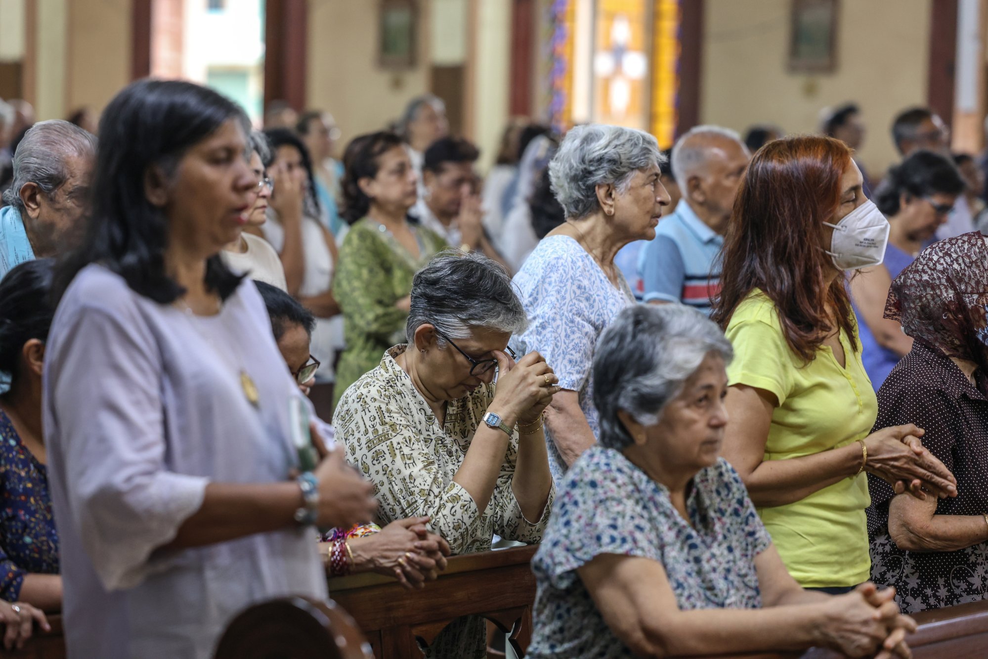 People offer prayers at St Peter’s Church in Mumbai during a special prayer meeting on July 12 for the crew members of the Air India flight crash. Photo: EPA People offer prayers at St Peter’s Church in Mumbai during a special prayer meeting on July 12 for the crew members of the Air India flight crash. Photo: EPA