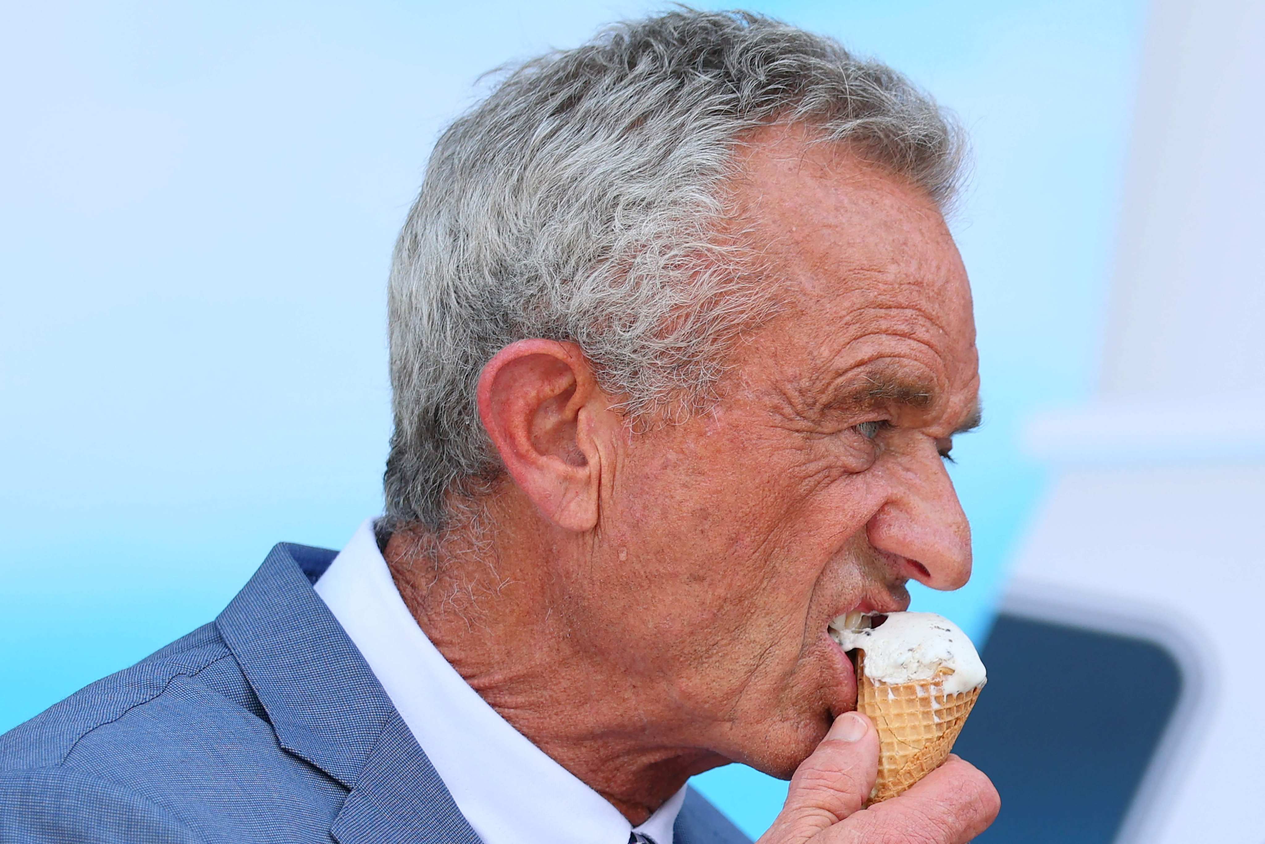 Health and Human Services Secretary Robert F. Kennedy Jnr eats a mint chocolate chip ice cream cone during a press conference announcing that ice cream makers are pledging to eliminate many artificial food dyes by the end of 2027. Photo: Getty Images/AFP