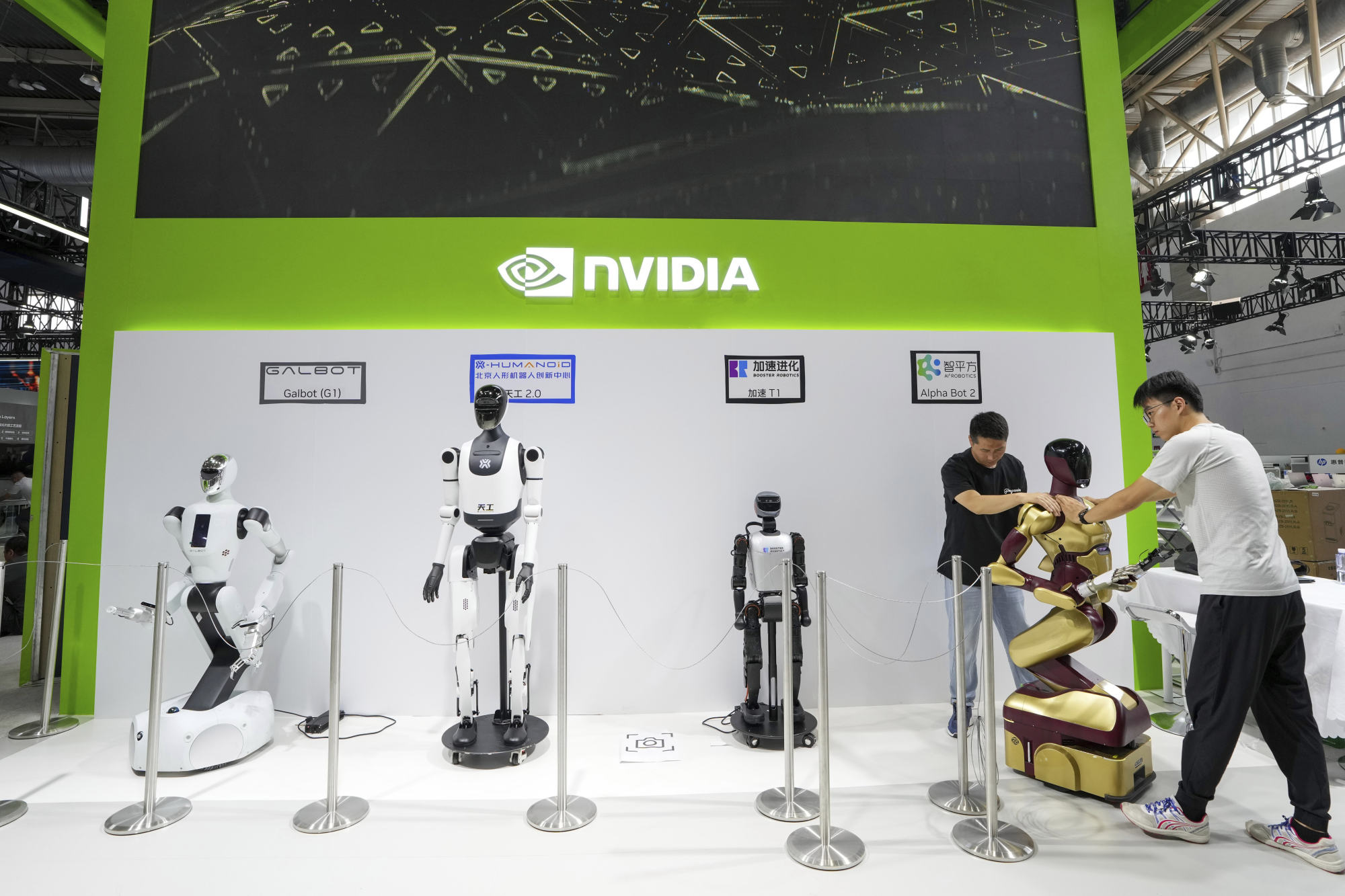 Workers set up a robot at the Nvidia booth of ahead of the third China International Supply Chain Expo in Beijing on Monday. Photo: Xinhua via AP Workers set up a robot at the Nvidia booth of ahead of the third China International Supply Chain Expo in Beijing on Monday. Photo: Xinhua via AP