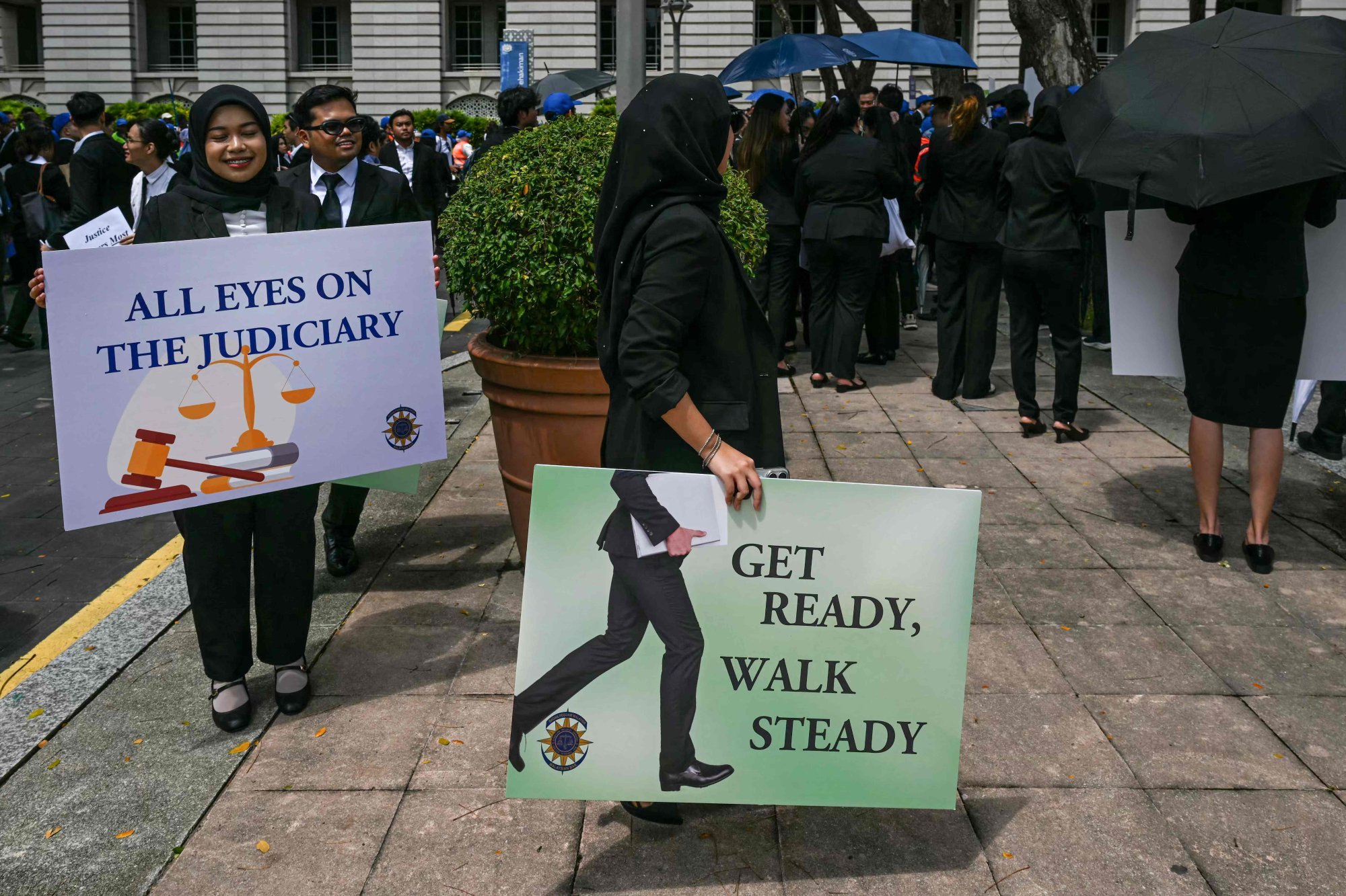 Malaysian Bar Council members hold placards during a rally near the prime minister’s office in Putrajaya on Monday to protest against the delay in appointing the country’s top judges. Photo: AFP